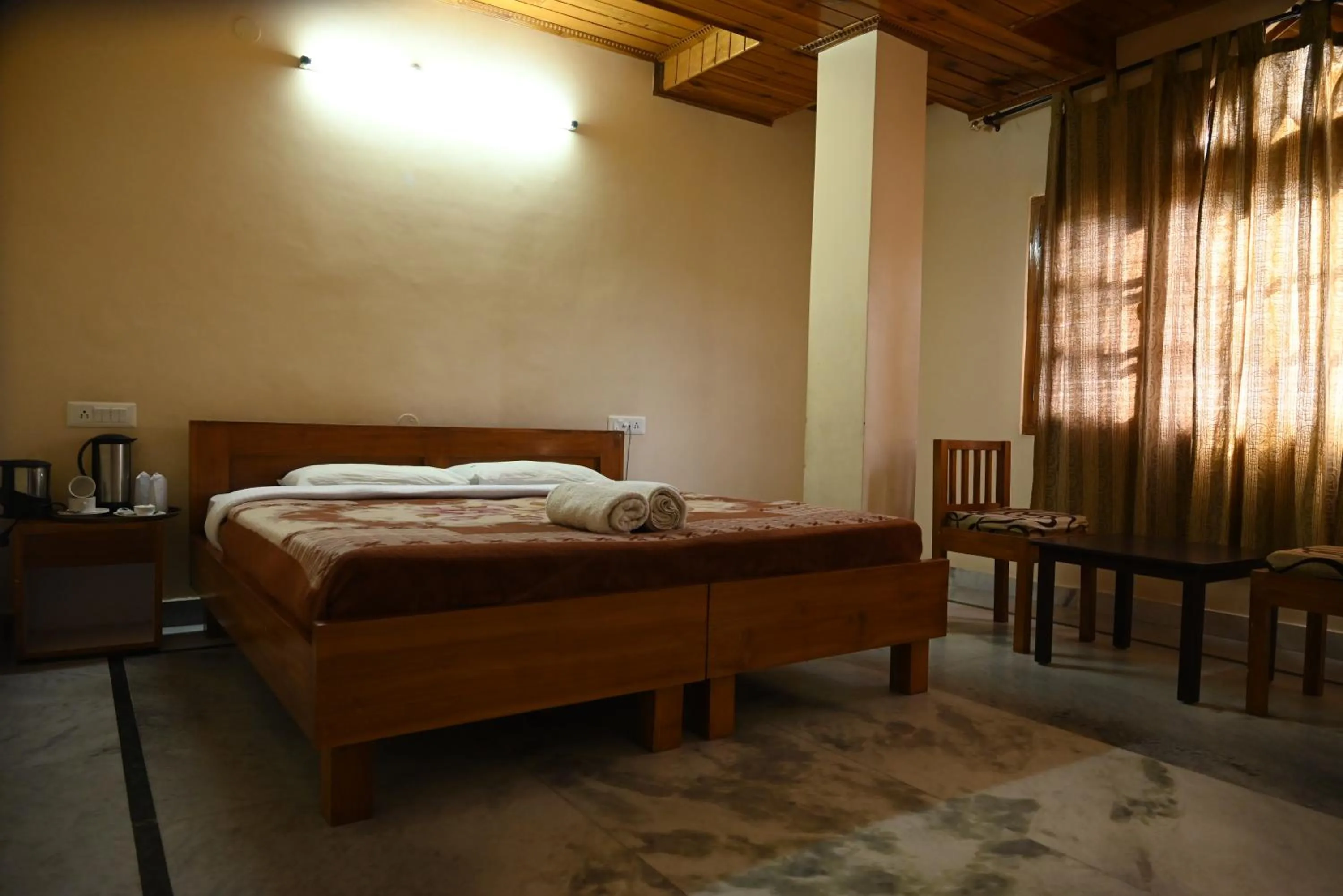 Bed in Hotel Atul Regency