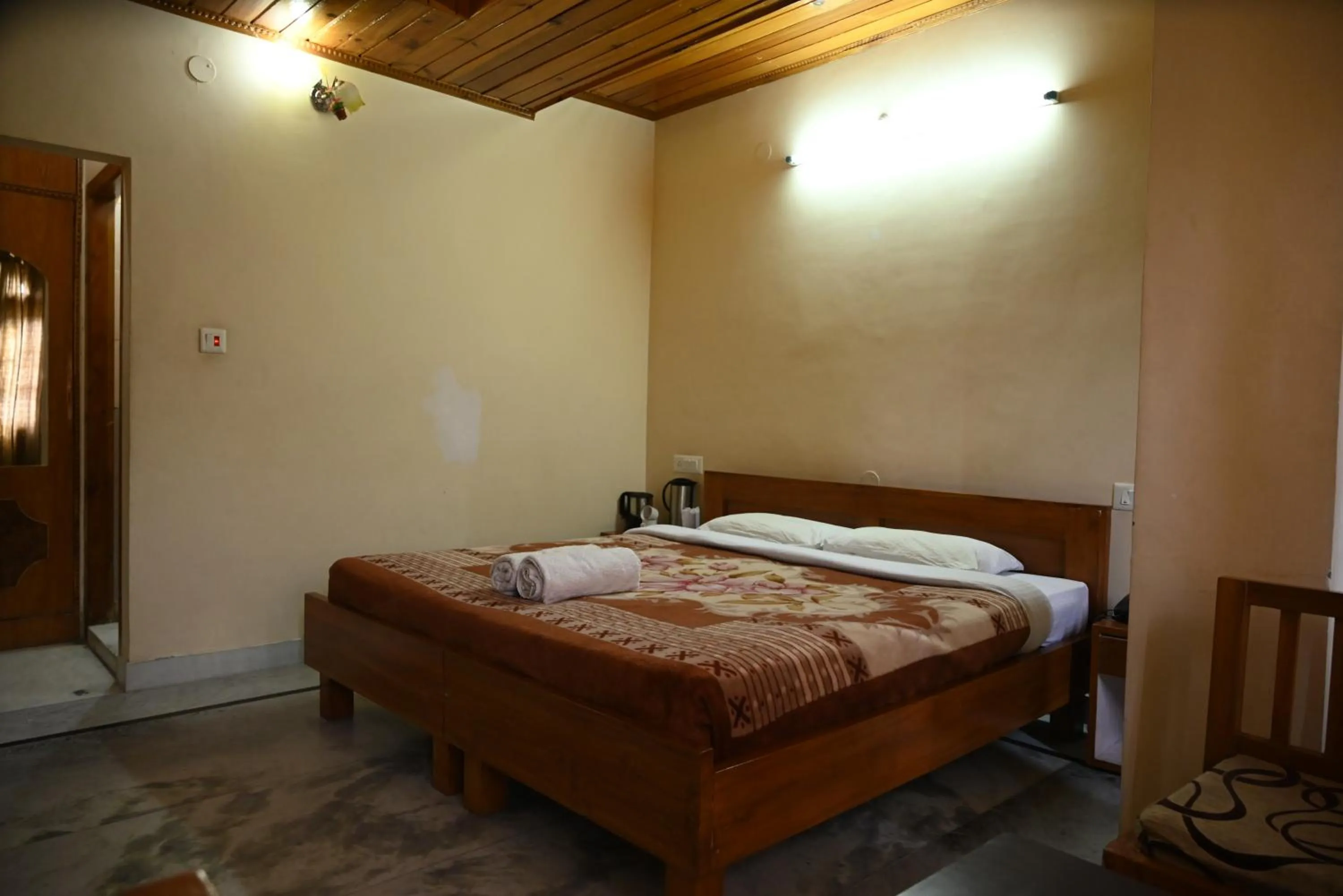 Bed in Hotel Atul Regency