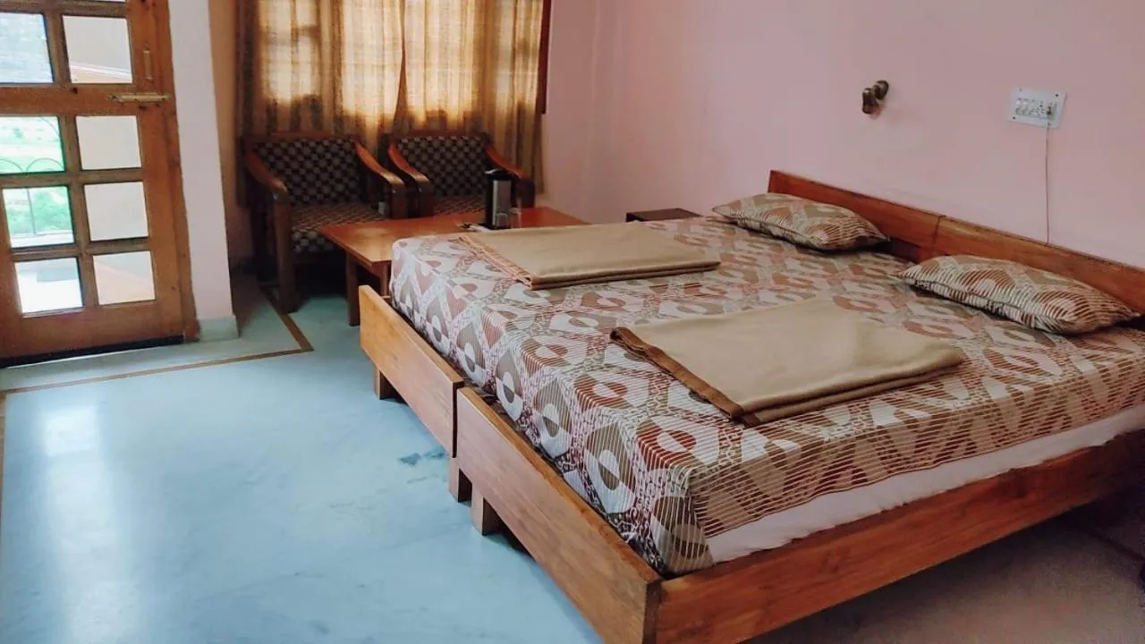 Bed in Hotel Atul Regency