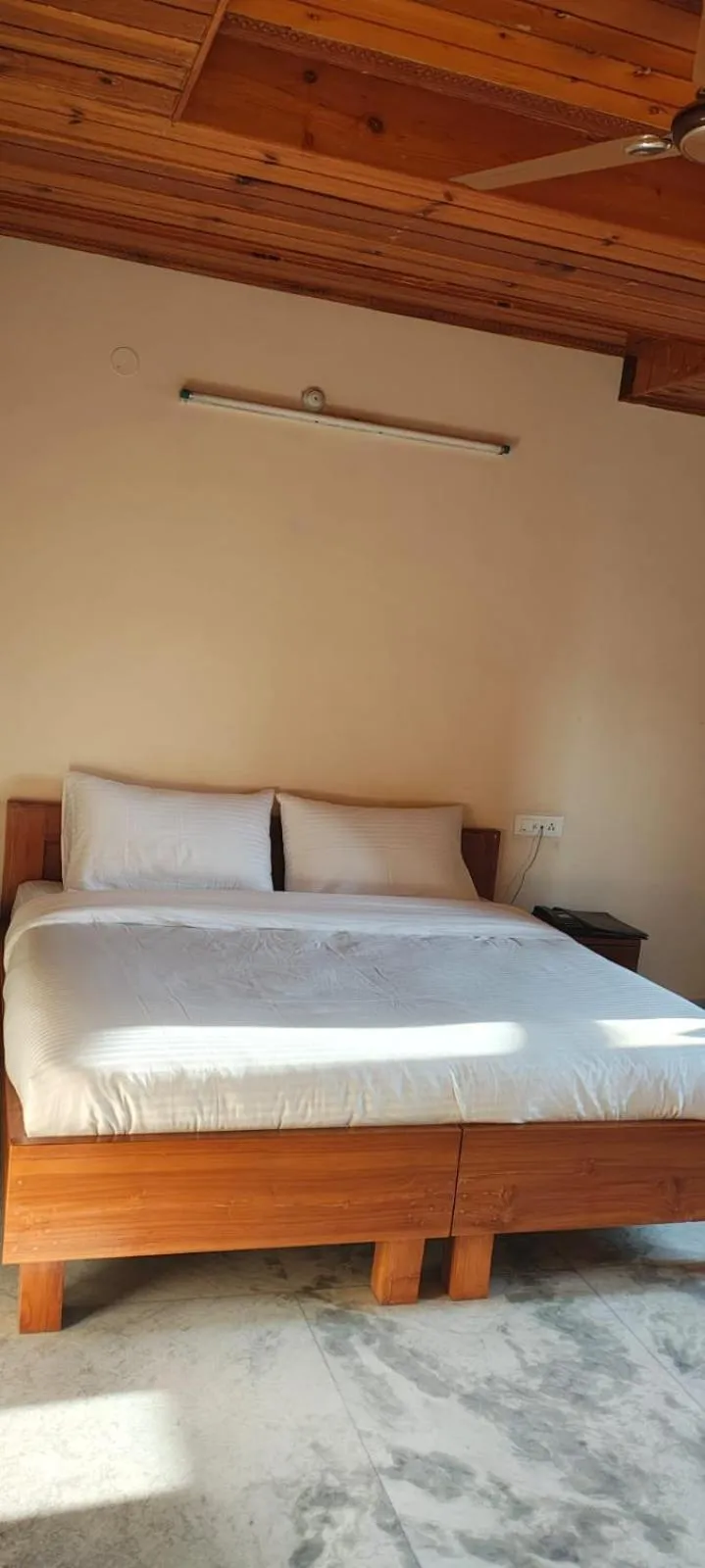 Bed in Hotel Atul Regency