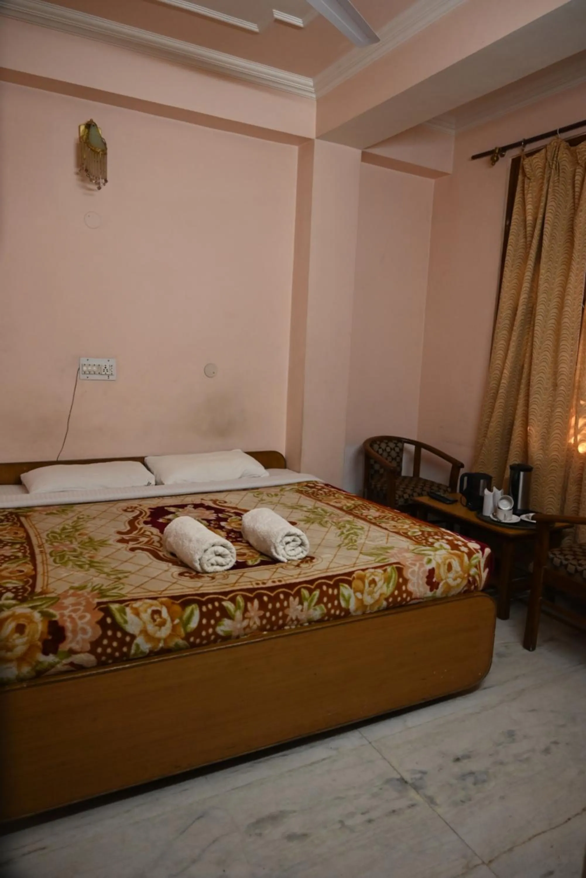 Bed in Hotel Atul Regency