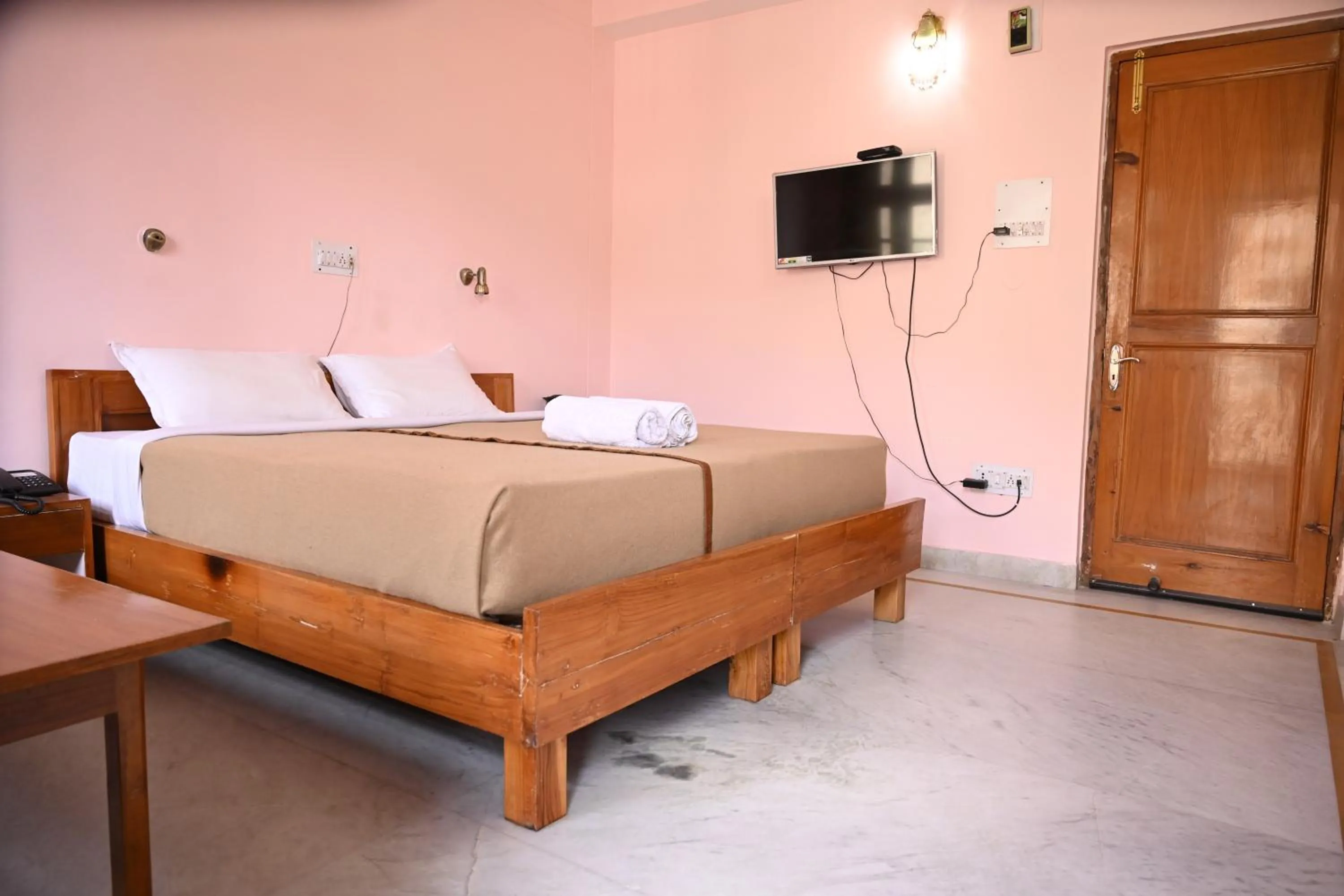 Bed in Hotel Atul Regency