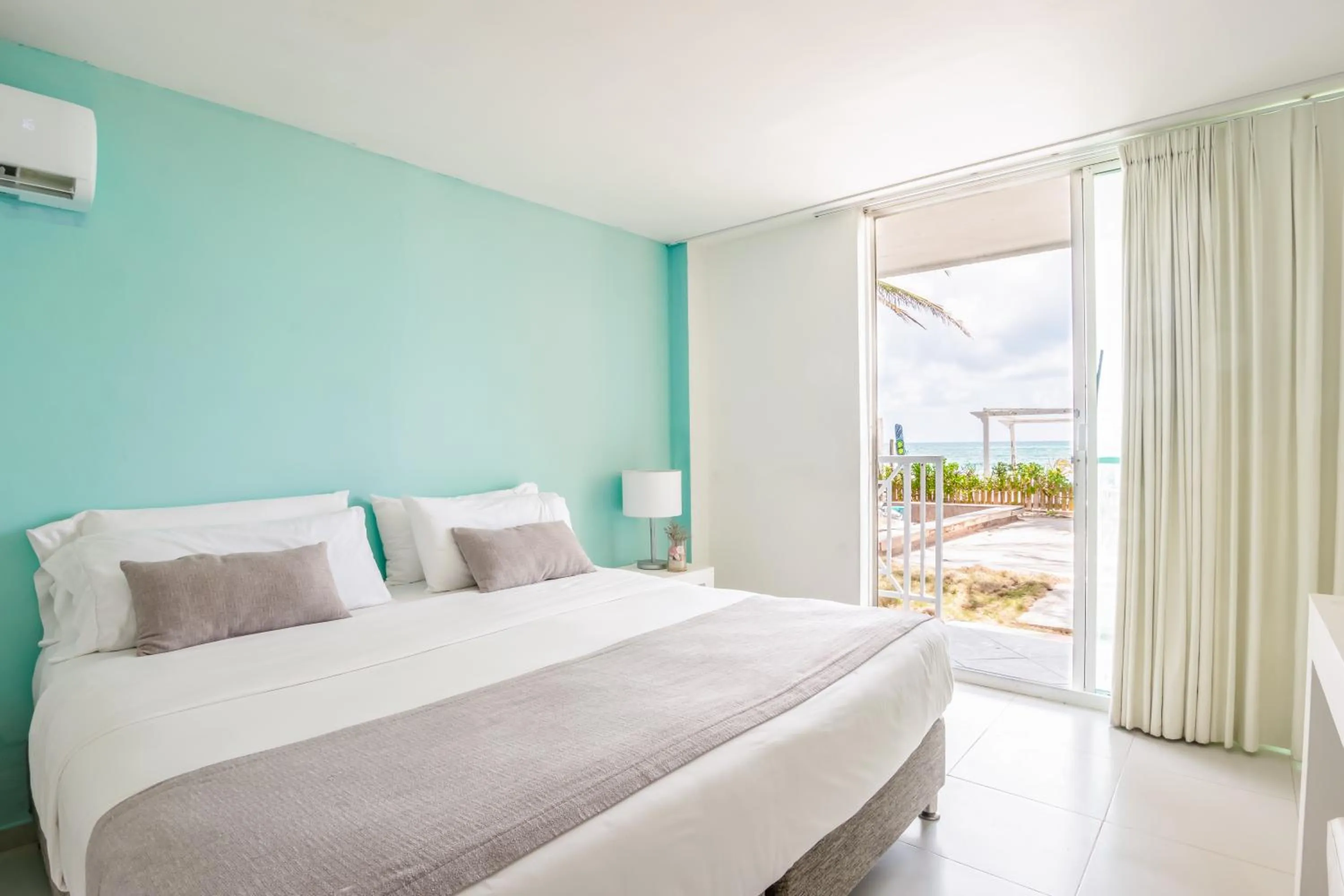 Bed in Hotel San Luis Beach House By OxoHotel