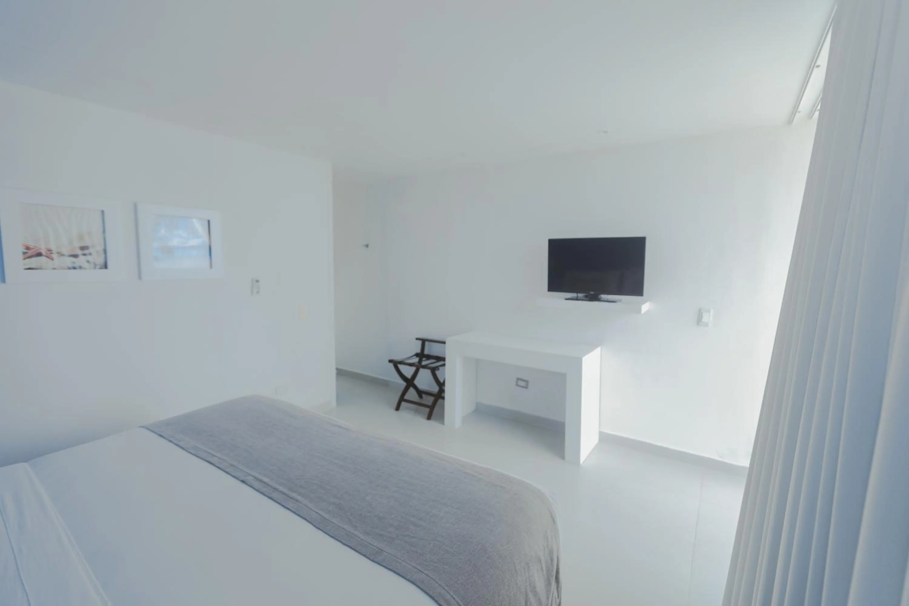 Bed in Hotel San Luis Beach House By OxoHotel