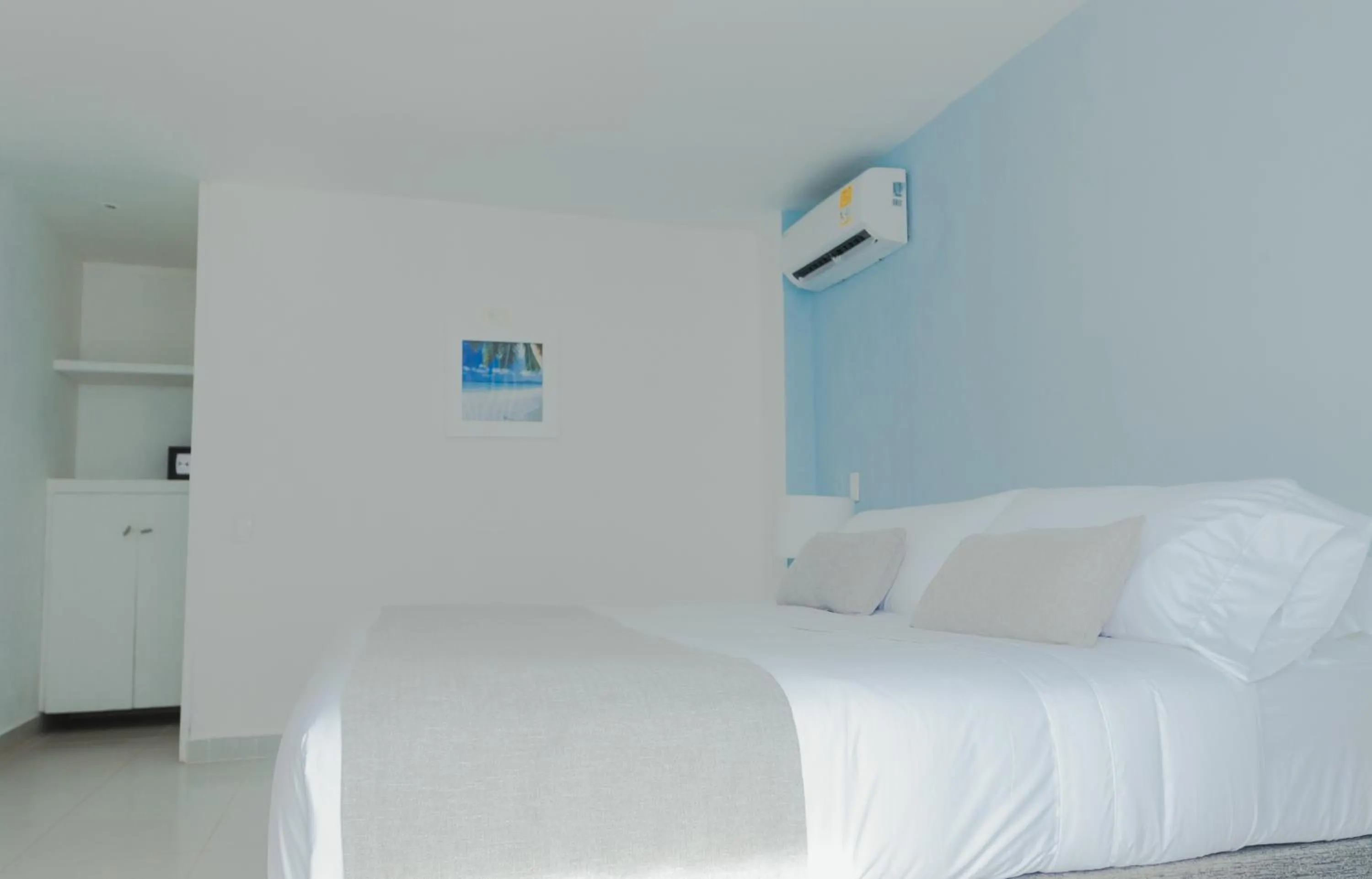 Bed in Hotel San Luis Beach House By OxoHotel