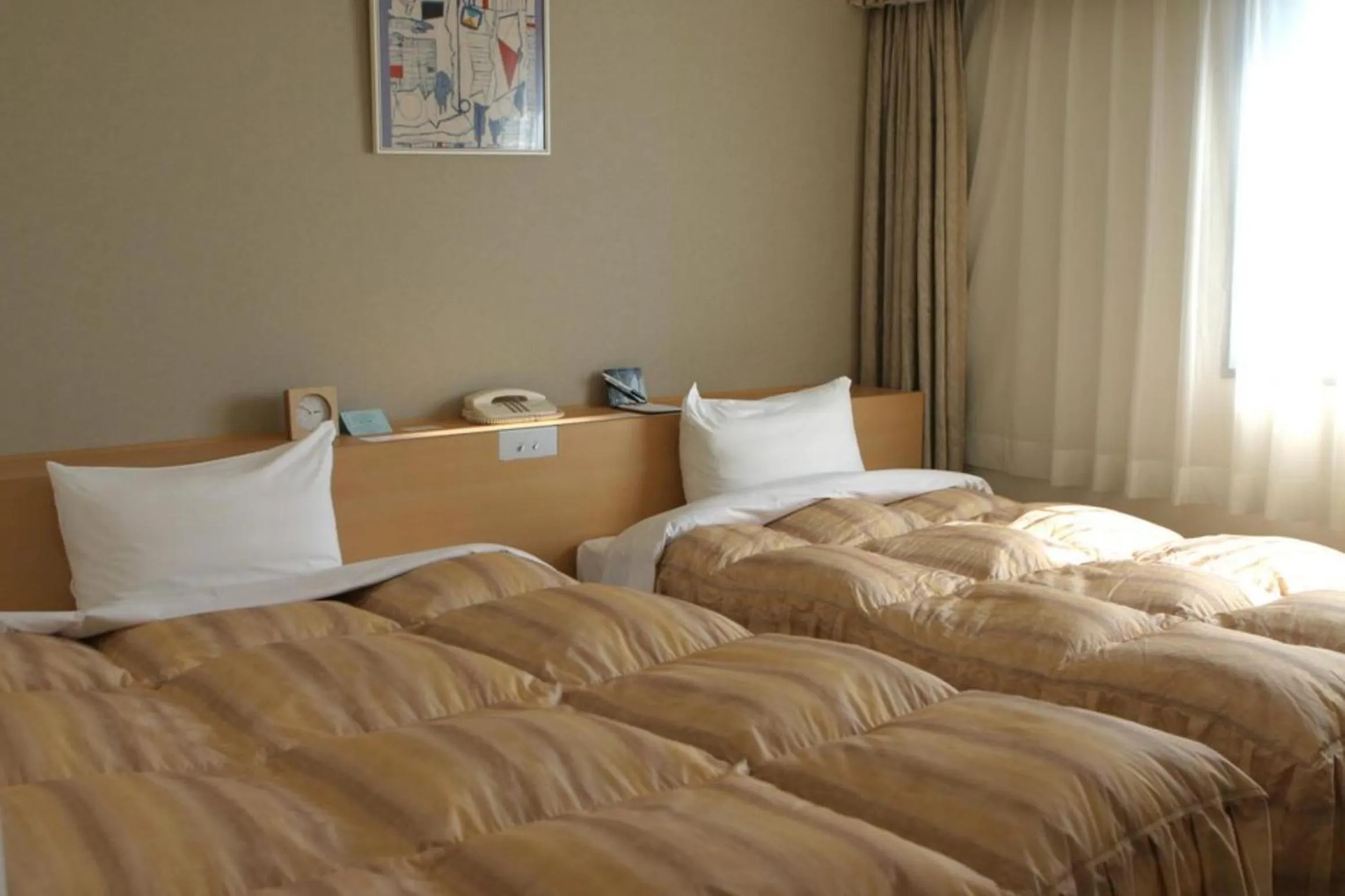 Bed in Okura Hotel Marugame