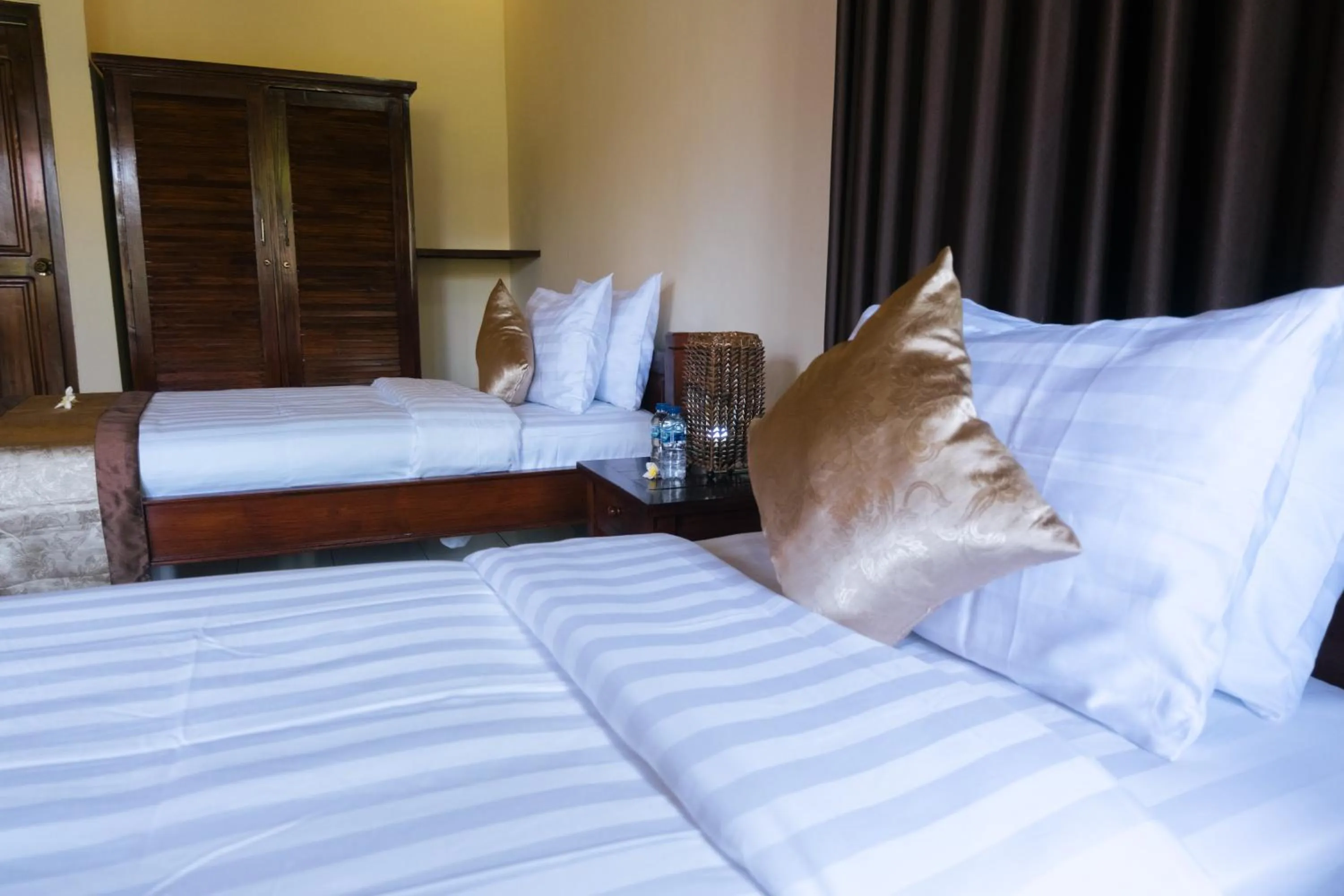 Bed in New Starlight Hotel Lovina