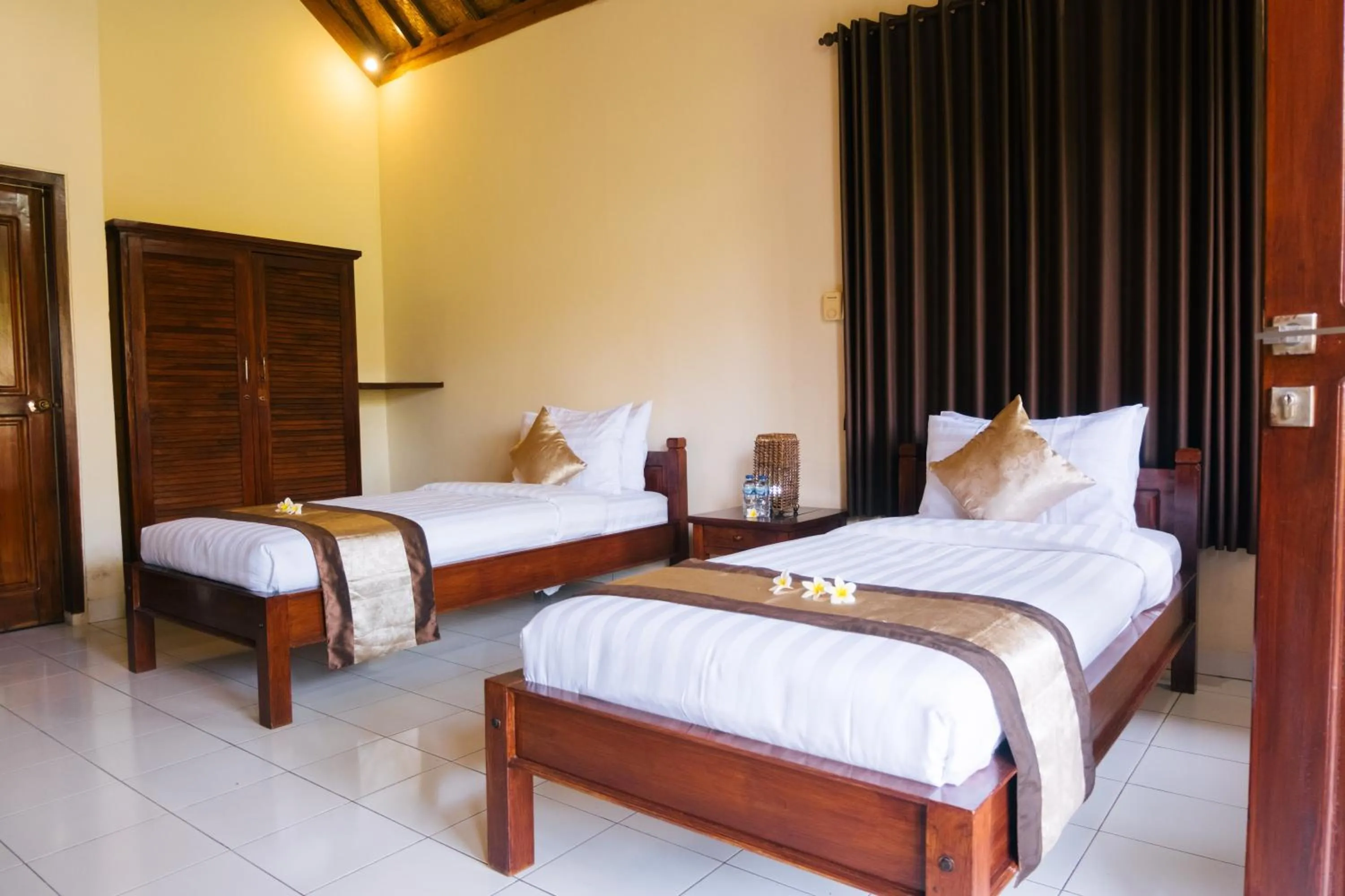 Bed in New Starlight Hotel Lovina