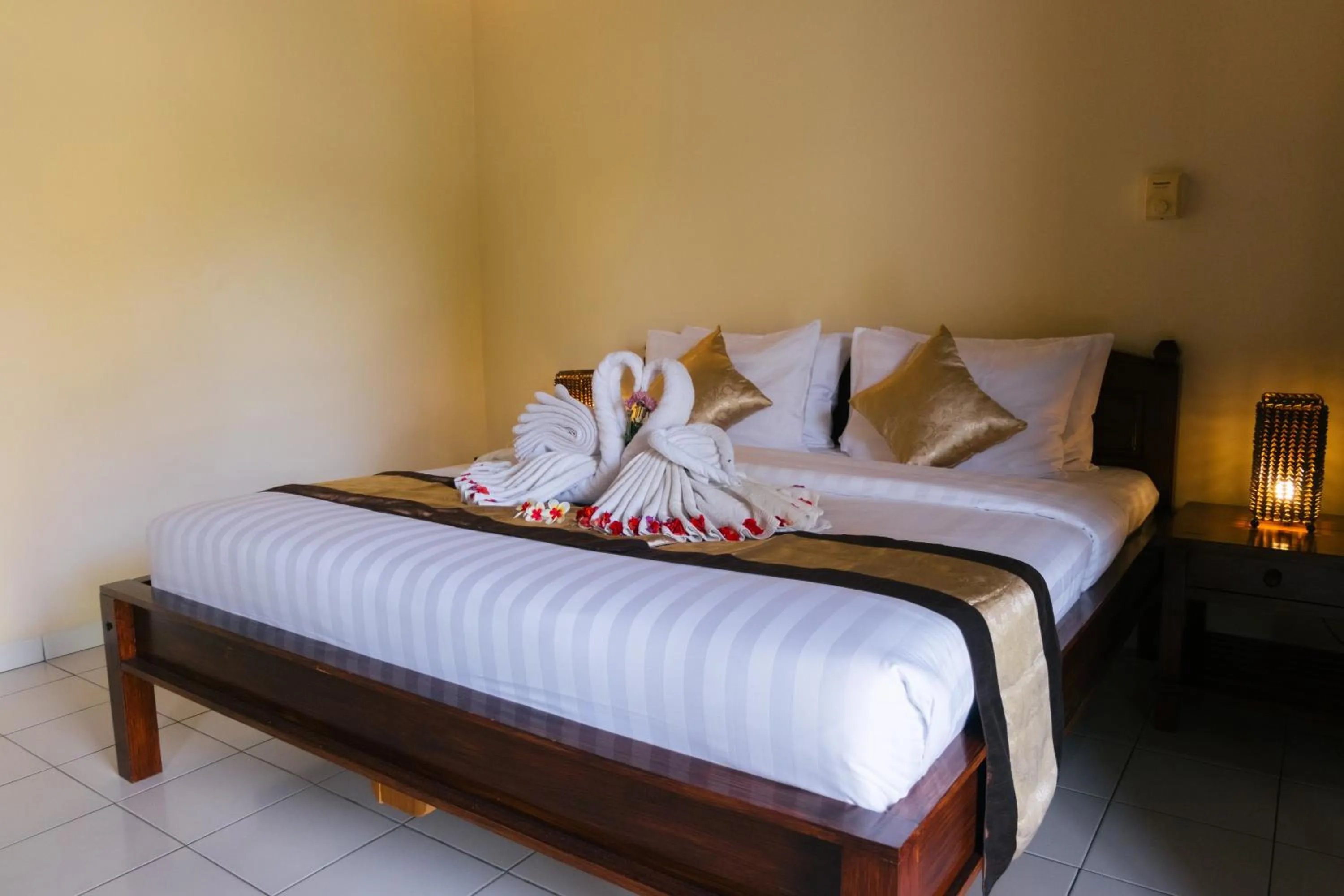 Bed in New Starlight Hotel Lovina