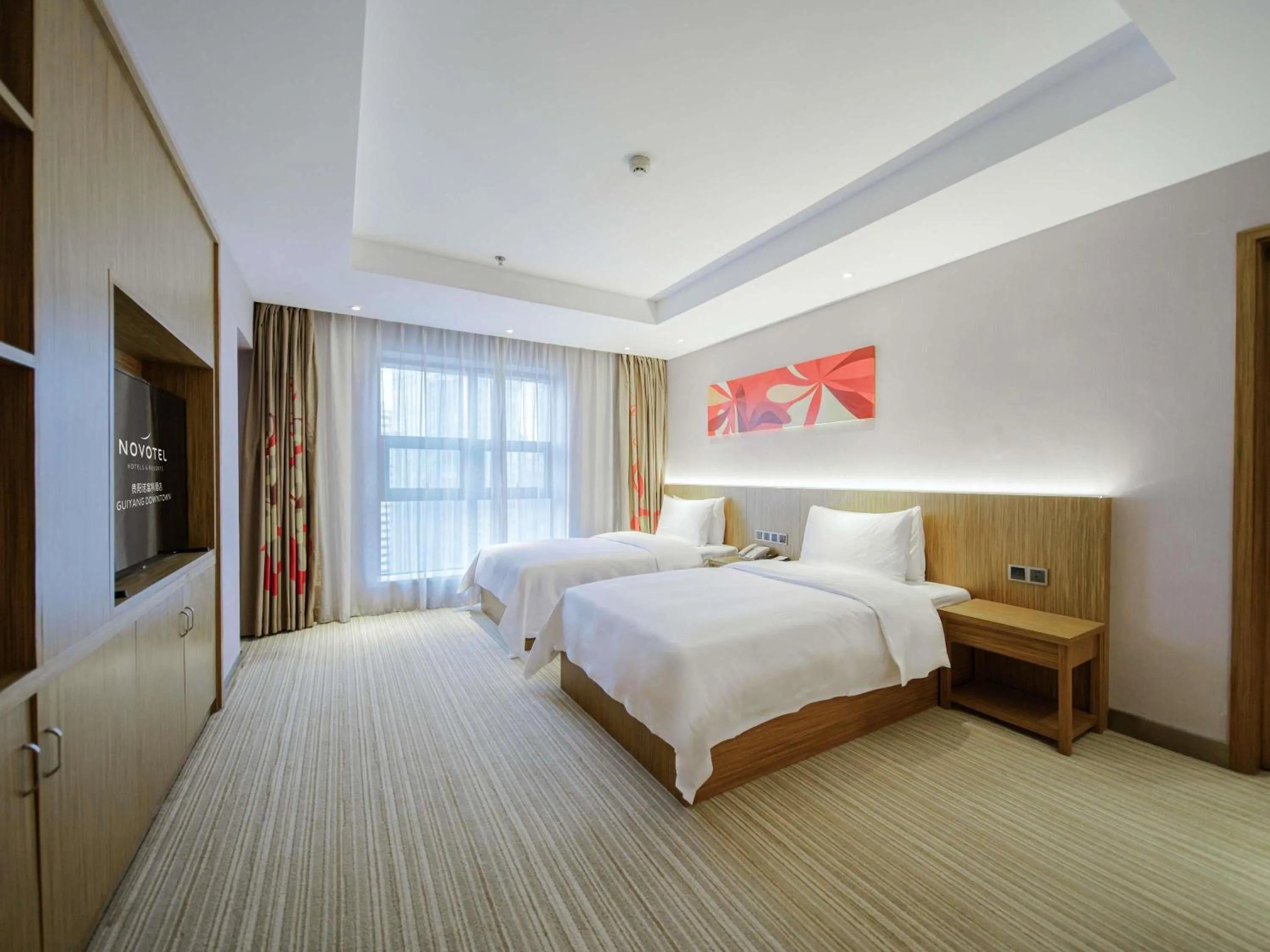 Photo of the whole room, Bed in Novotel Guiyang Downtown