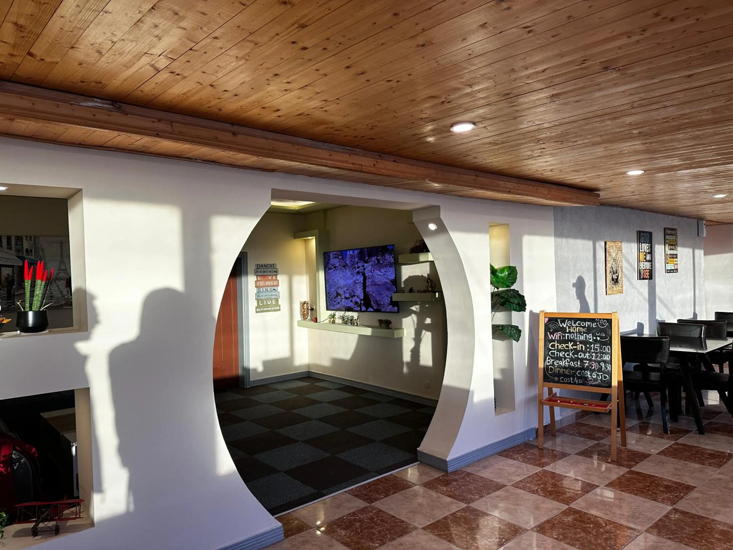 Communal lounge/ TV room in Rafiki Hostel