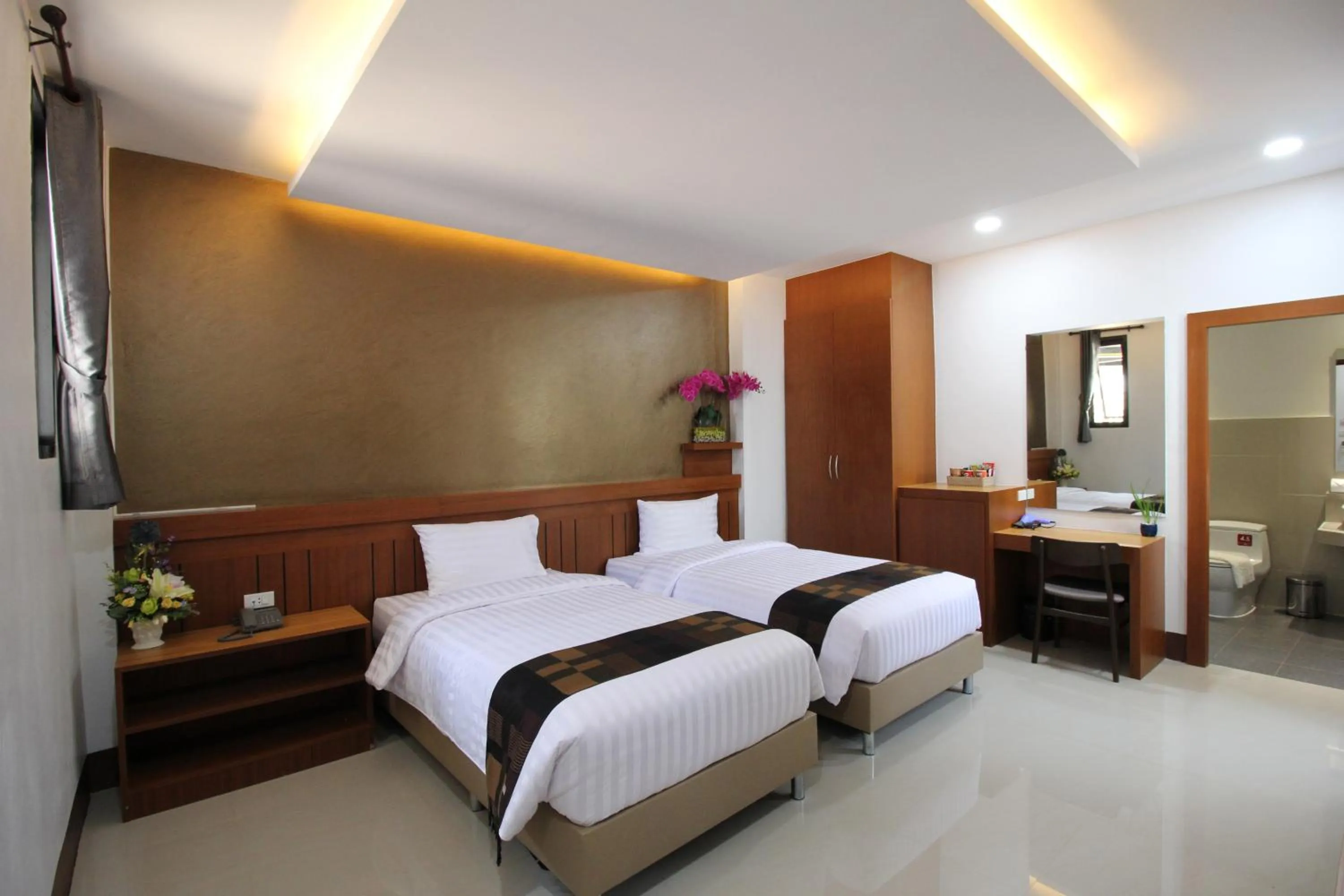 Bed in Nonghan Grand Hotel and Resort