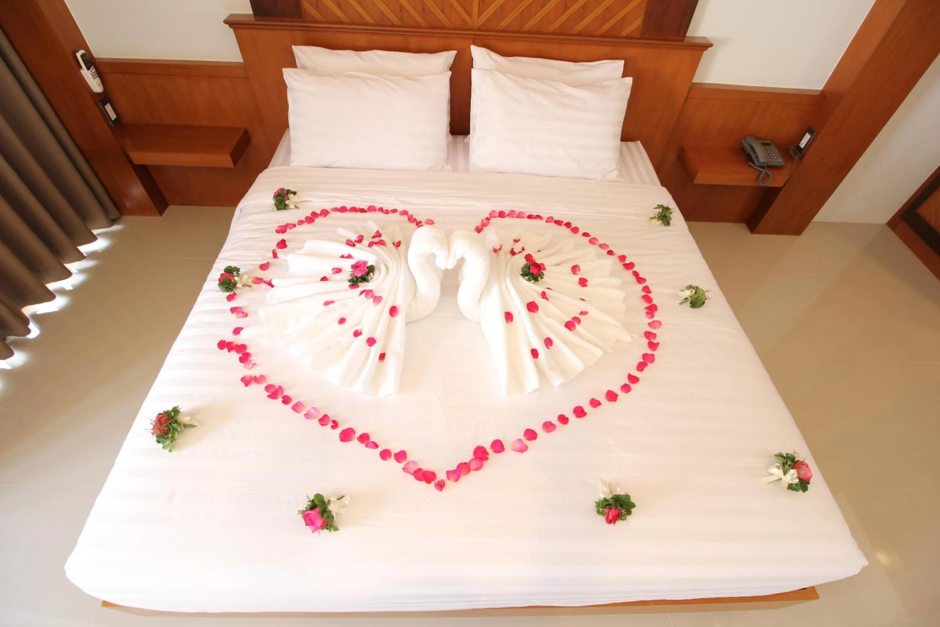 Bed in Nonghan Grand Hotel and Resort