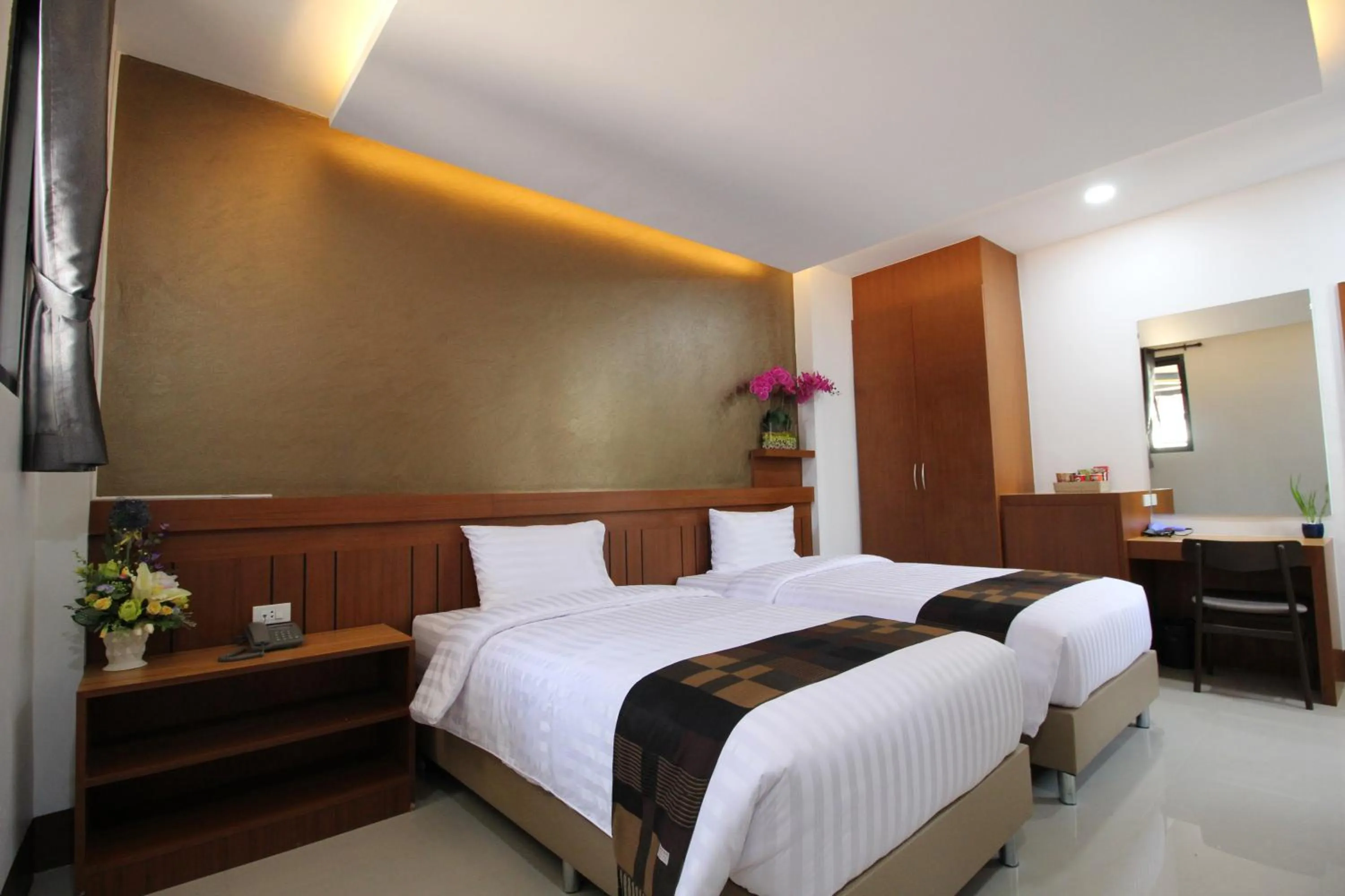 Bed in Nonghan Grand Hotel and Resort