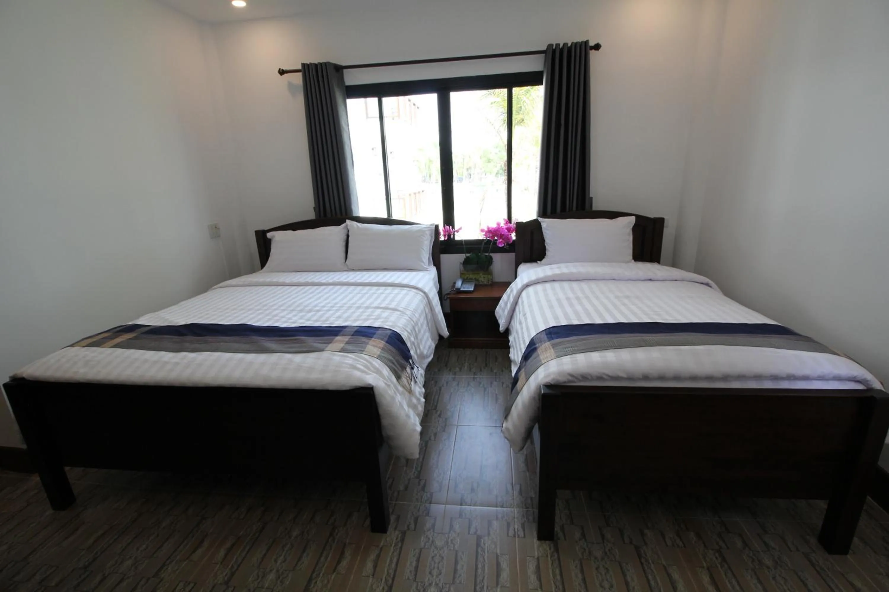 Bed in Nonghan Grand Hotel and Resort