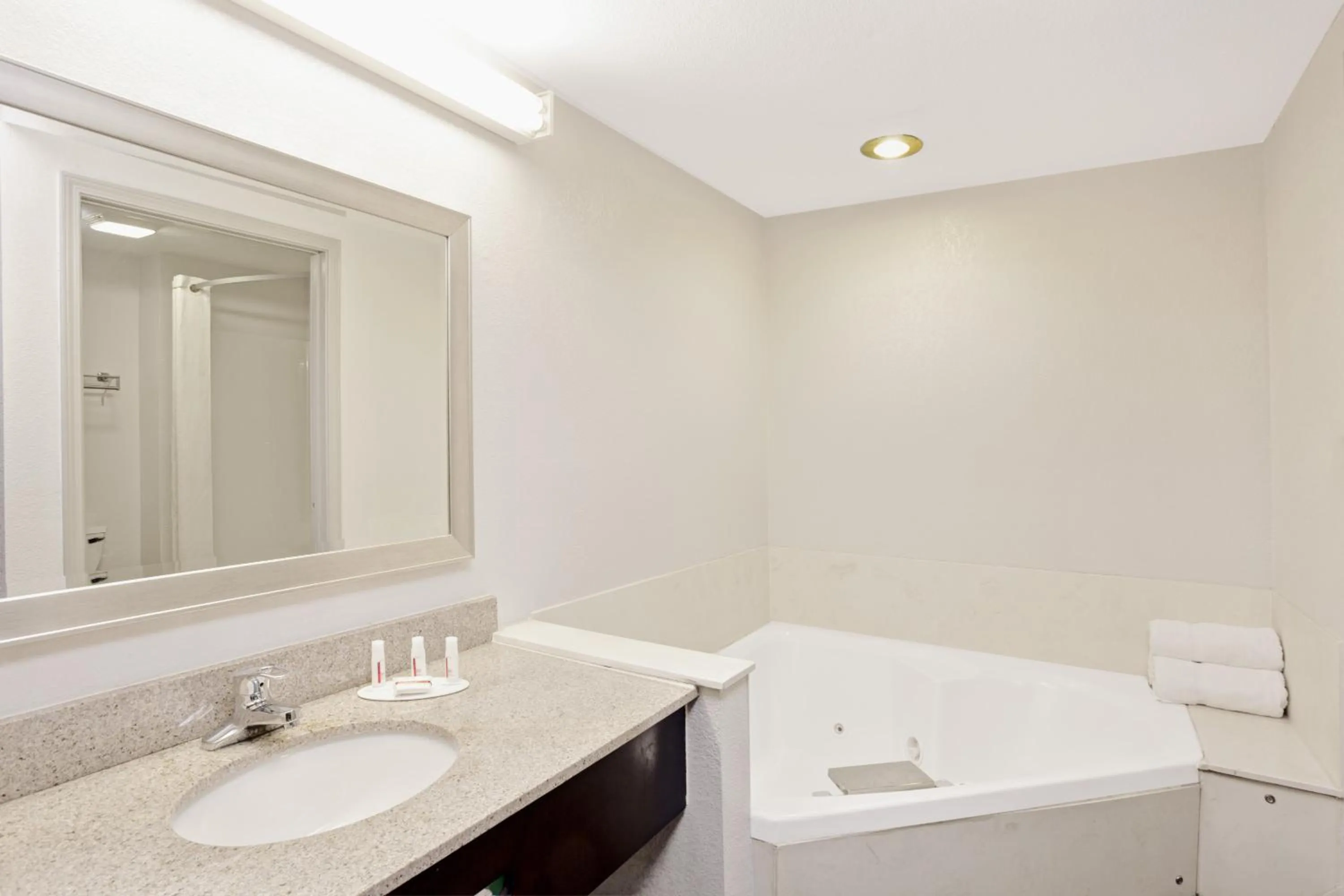 Bathroom in Super 8 by Wyndham Gainesville