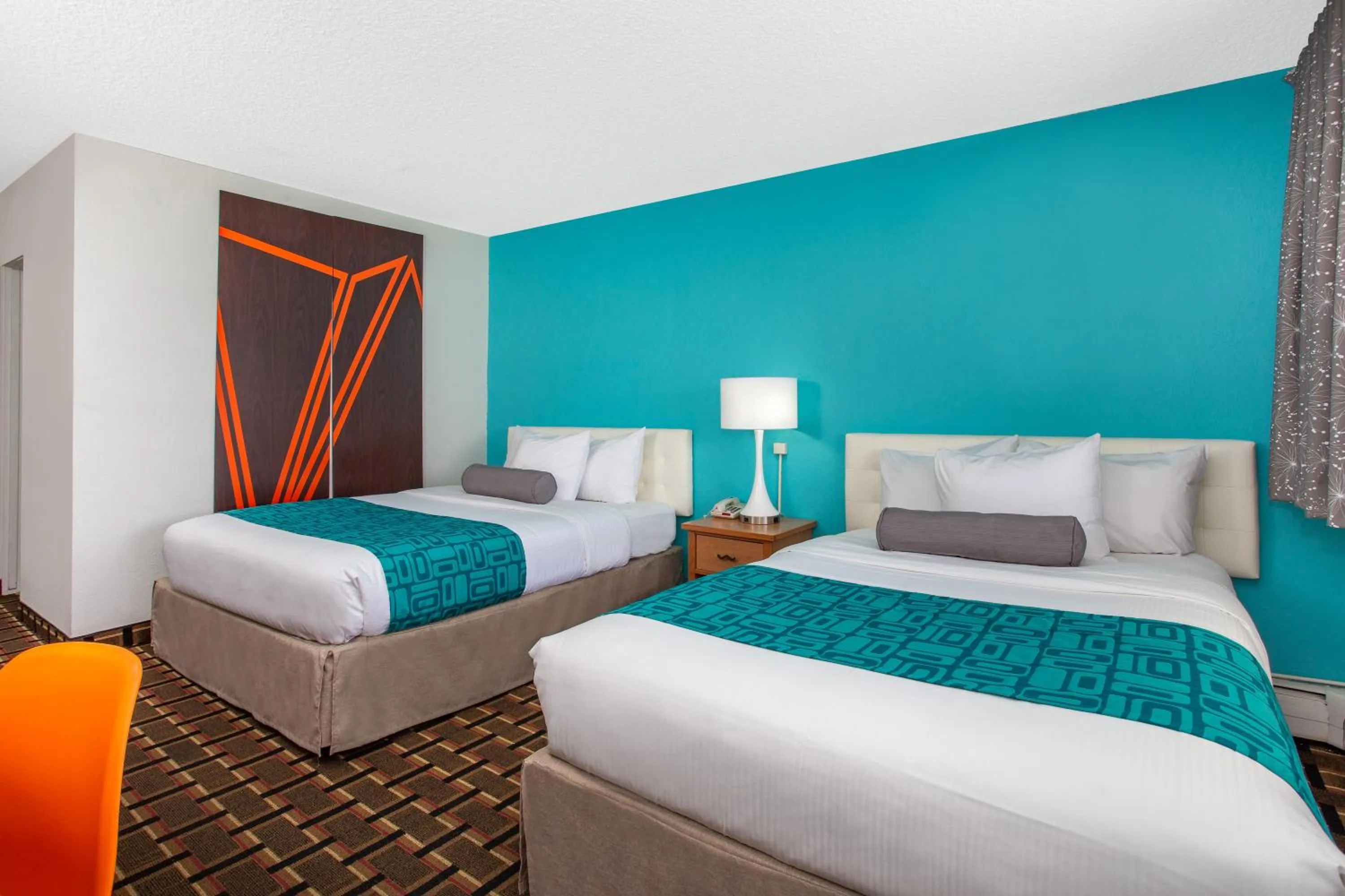 Bed in Howard Johnson by Wyndham Colorado Springs