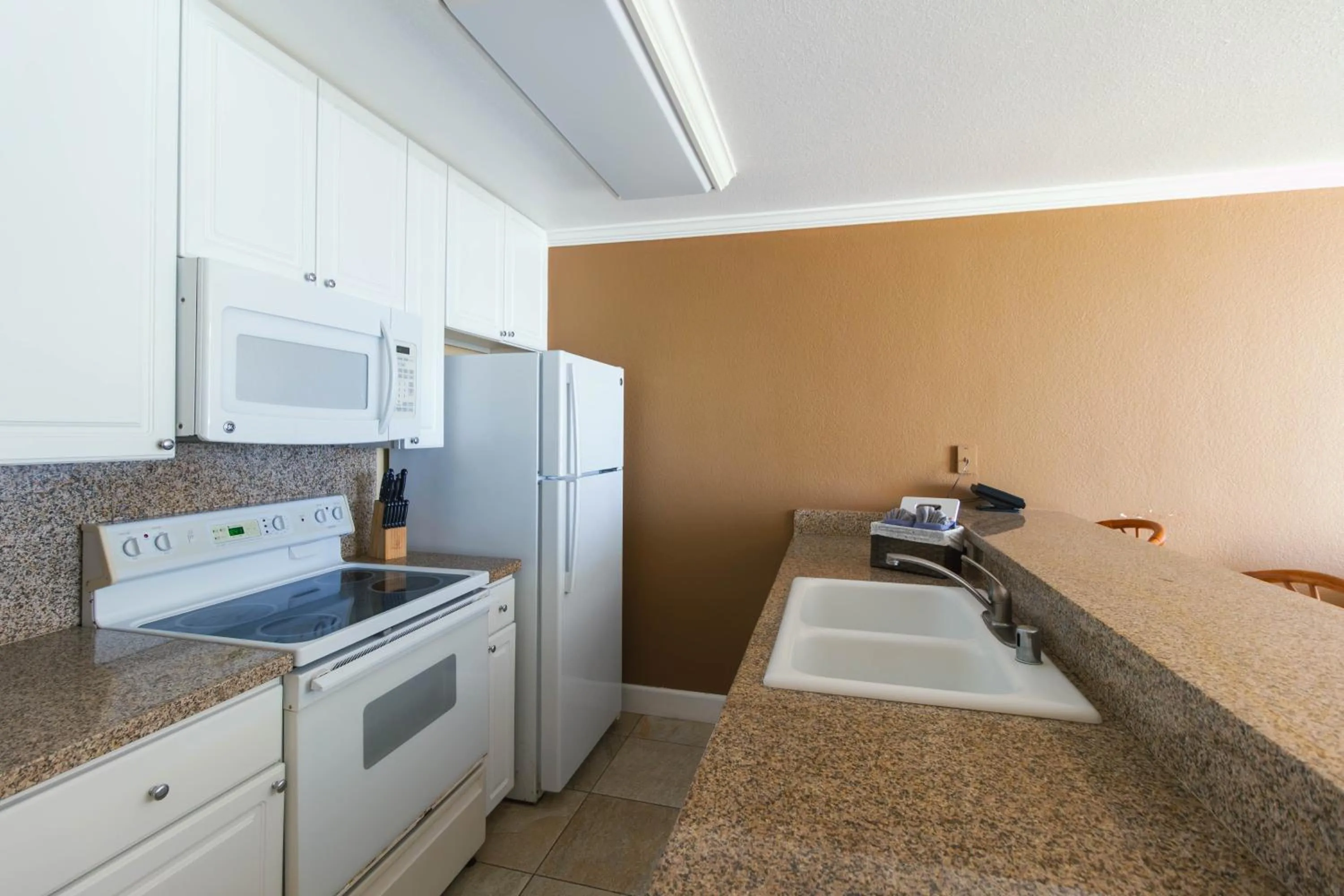 kitchen in Kona Reef Resort by Latour Group