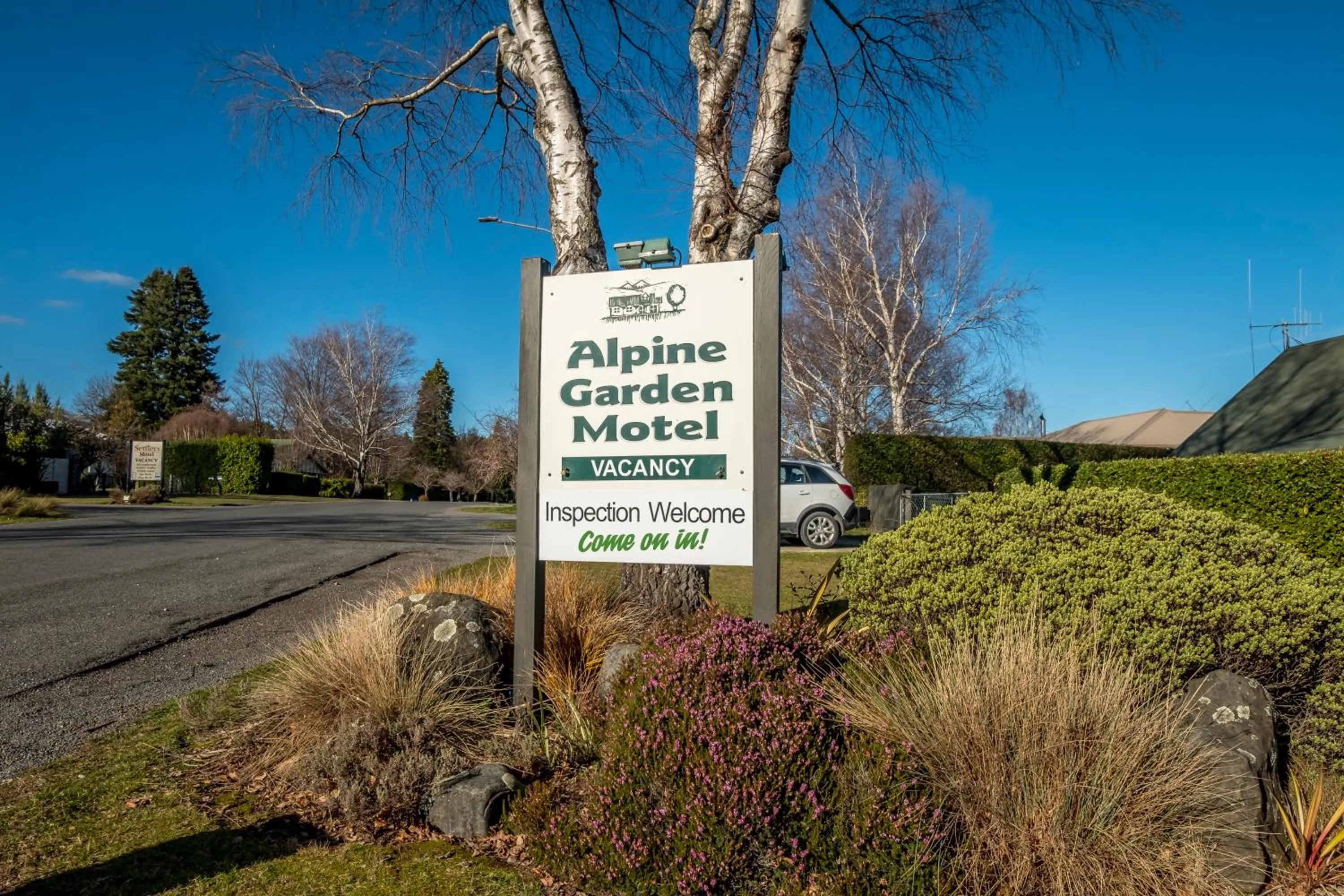 Property logo or sign in Alpine Garden Motel