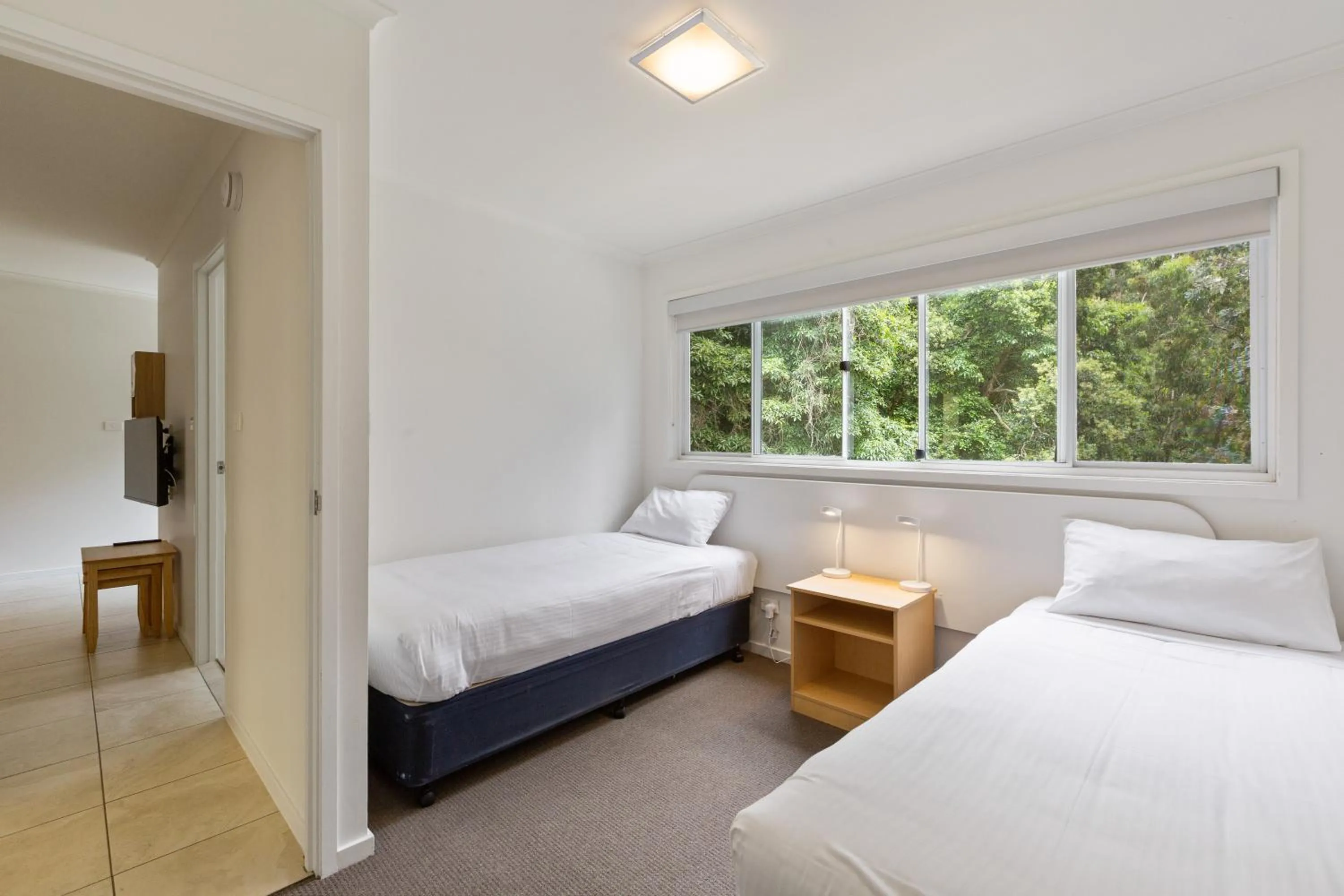 Bed in Tathra Beach House Holiday Apartments