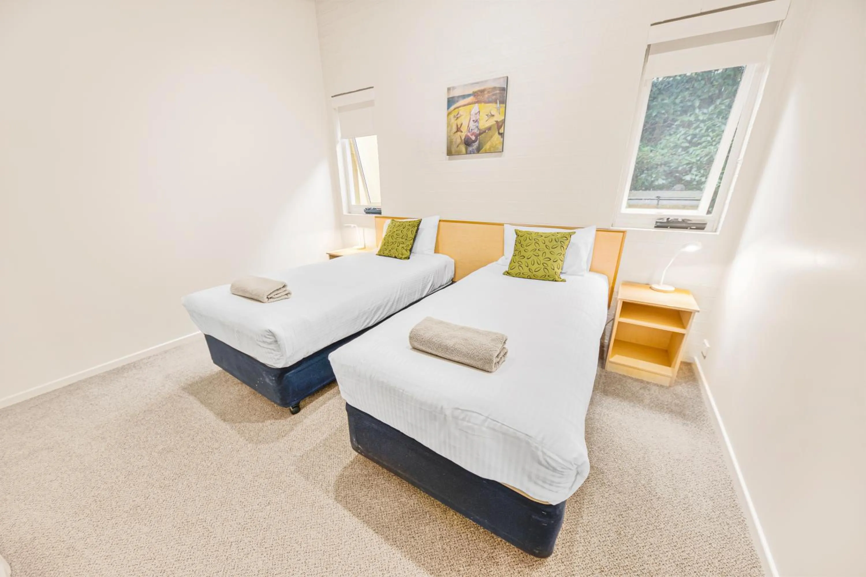 Bed in Tathra Beach House Holiday Apartments