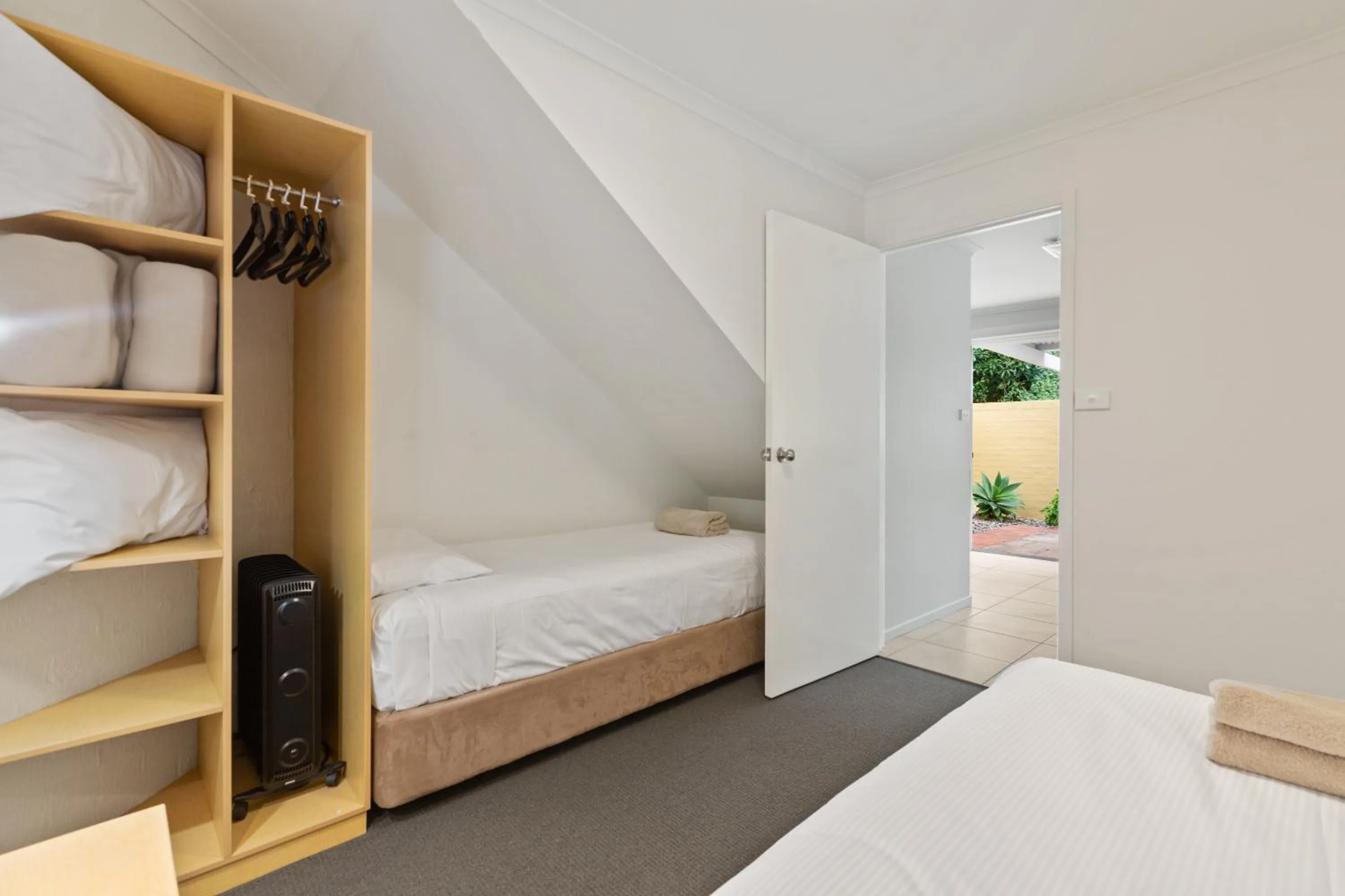 Bed in Tathra Beach House Holiday Apartments