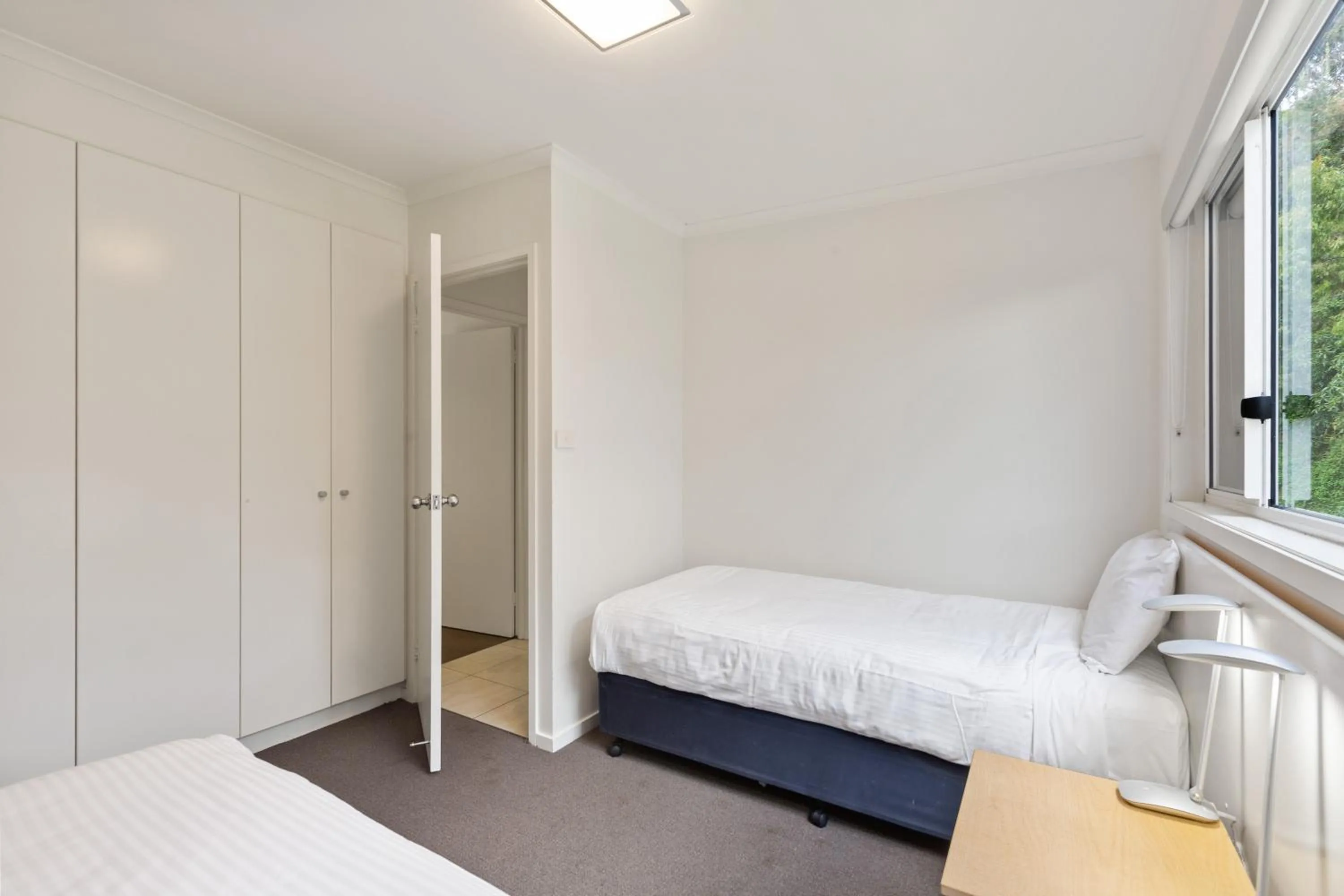 Bed in Tathra Beach House Holiday Apartments