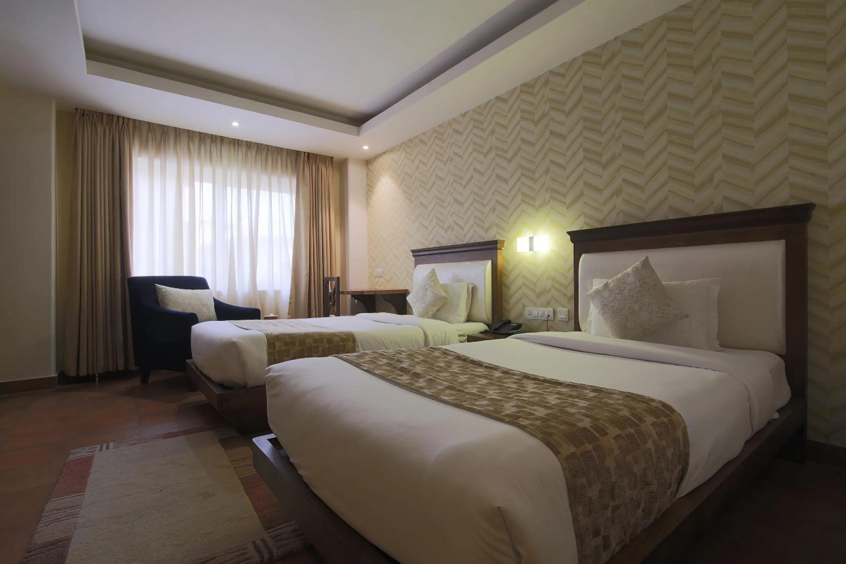 Bed in Teeka Resort Suites & Spa