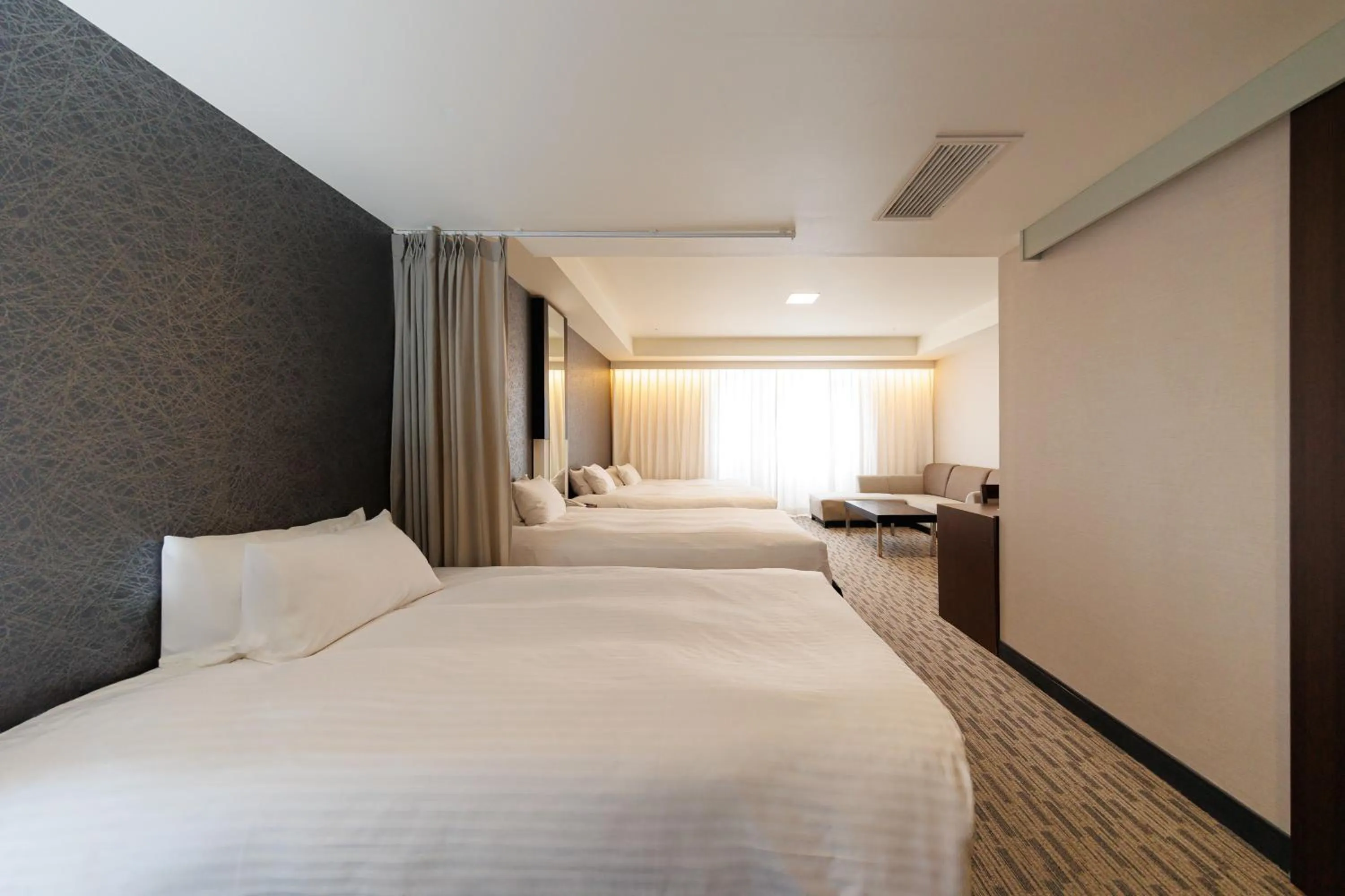 Bed in Kokusai 21 International Hotel