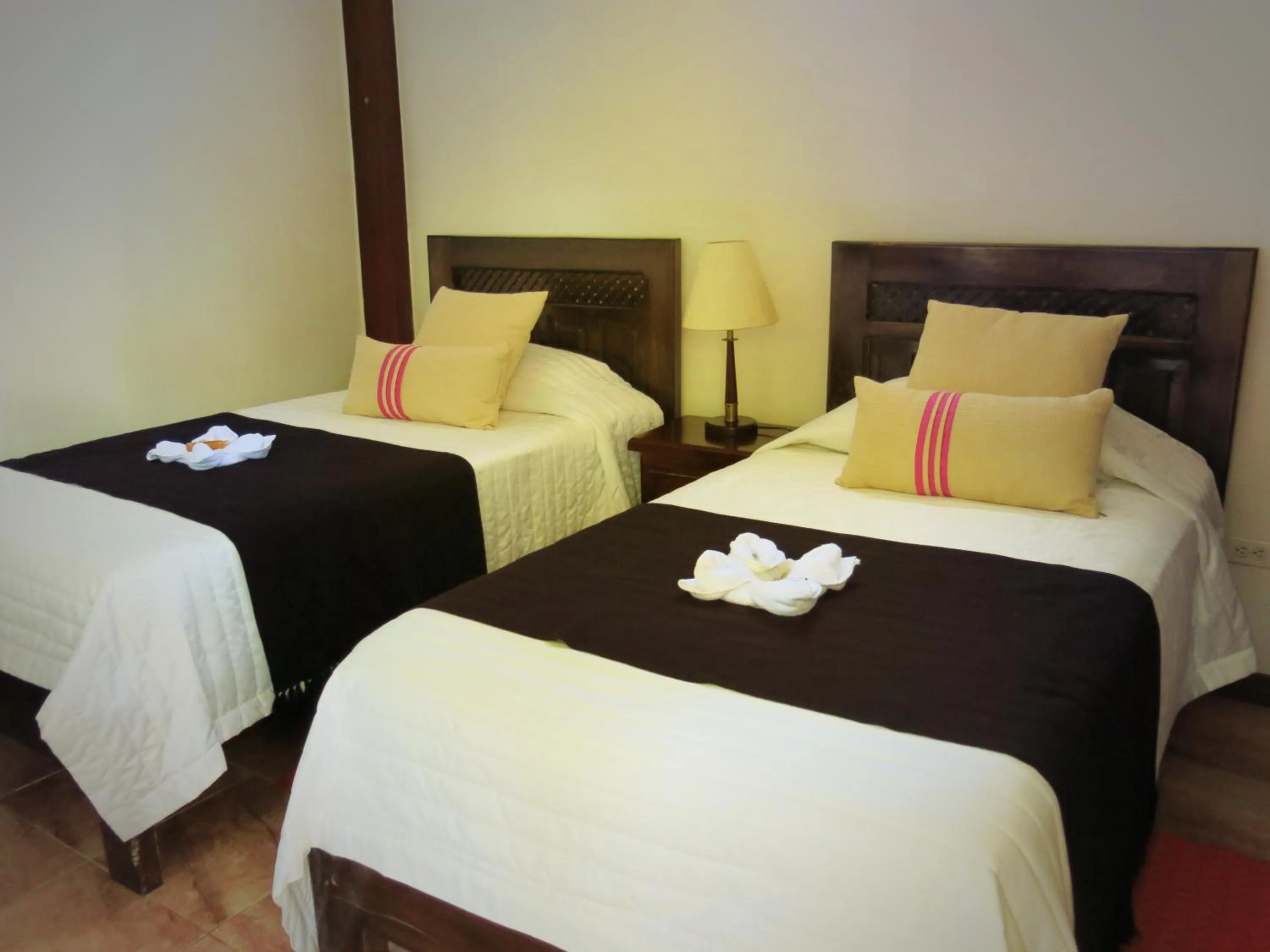 Bed in The Wooden House Hotel