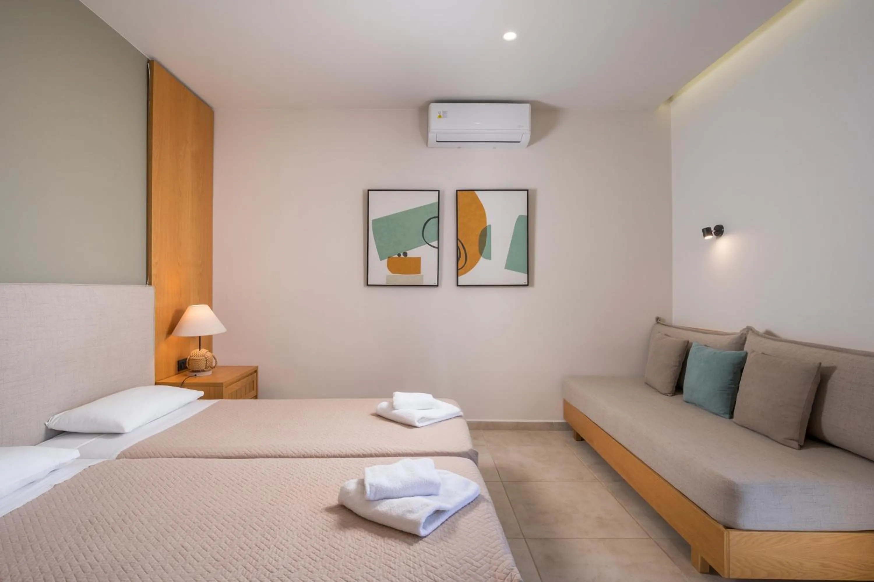 Bed in Petritos Rooms and Studios