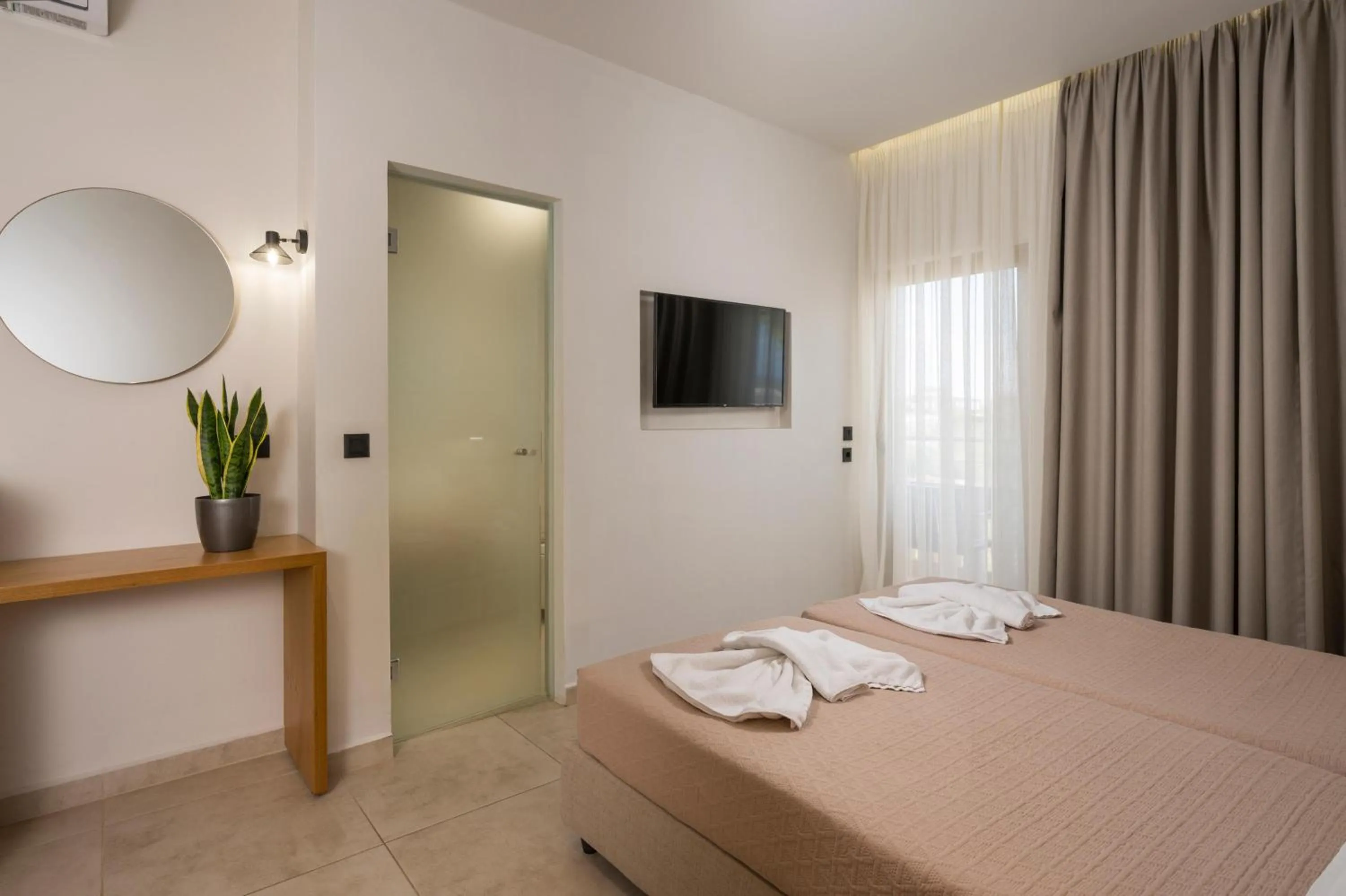 Bed in Petritos Rooms and Studios