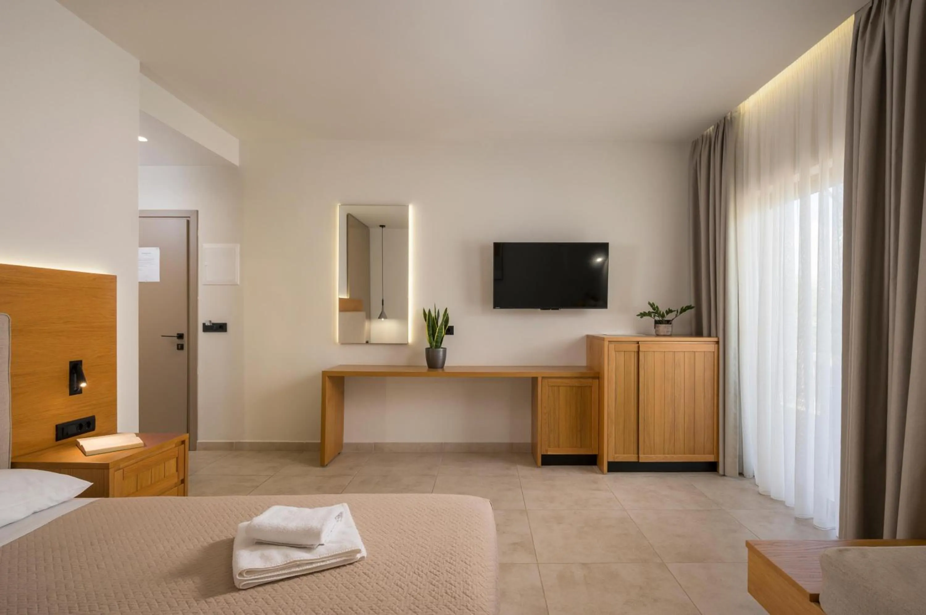 Bed in Petritos Rooms and Studios