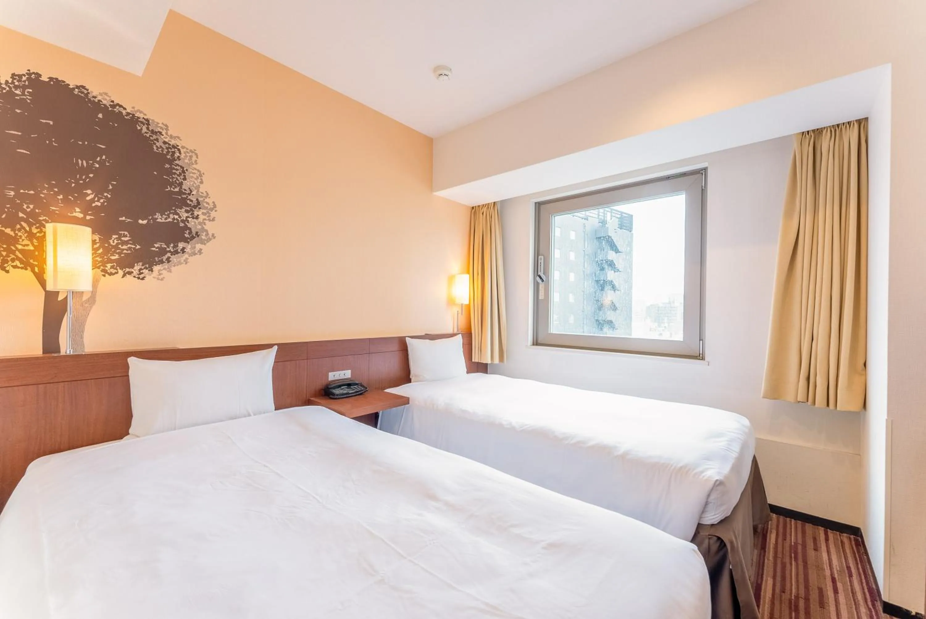 Bed in Hotel Keihan Asakusa