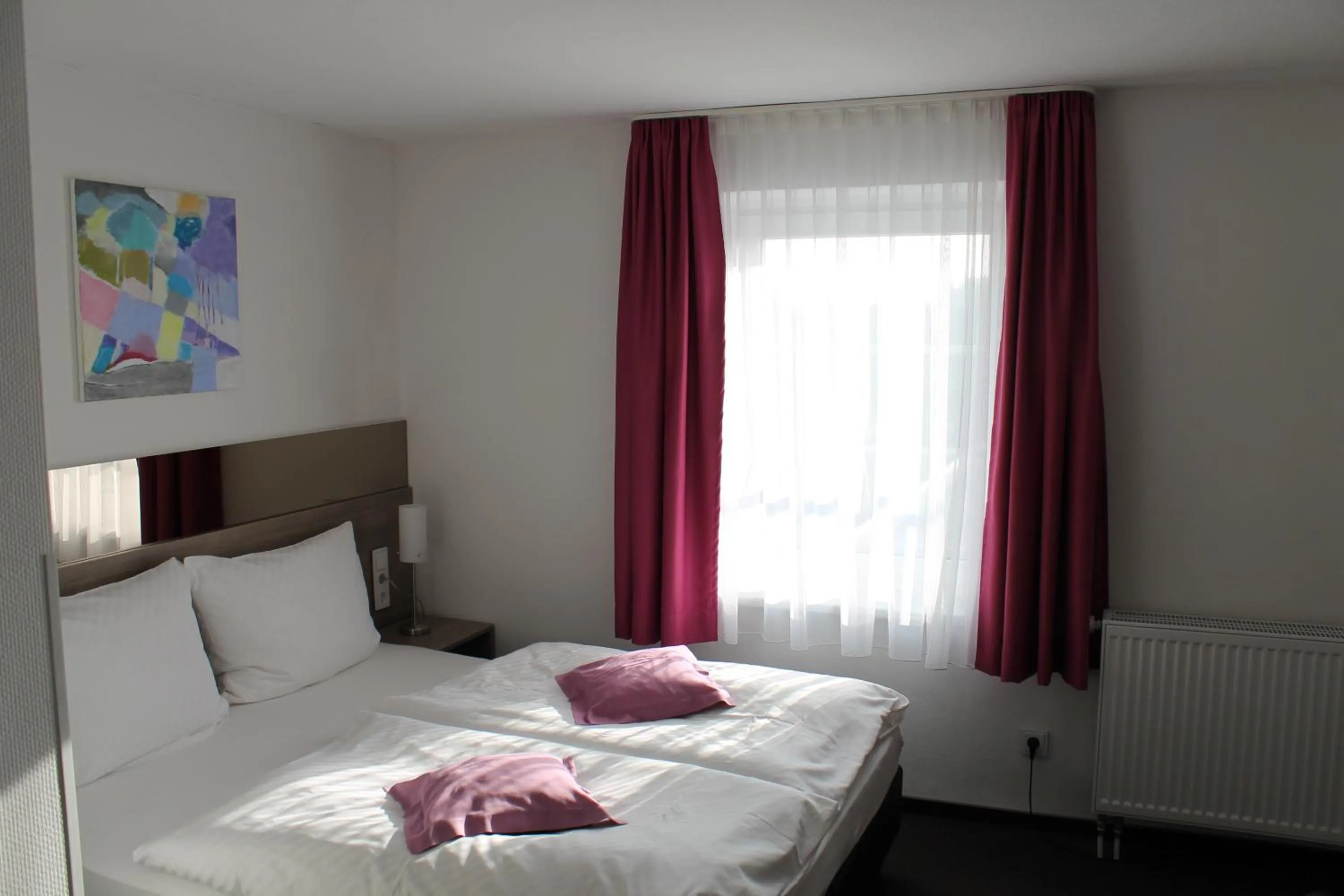 Bed in RheinHotel ARTE