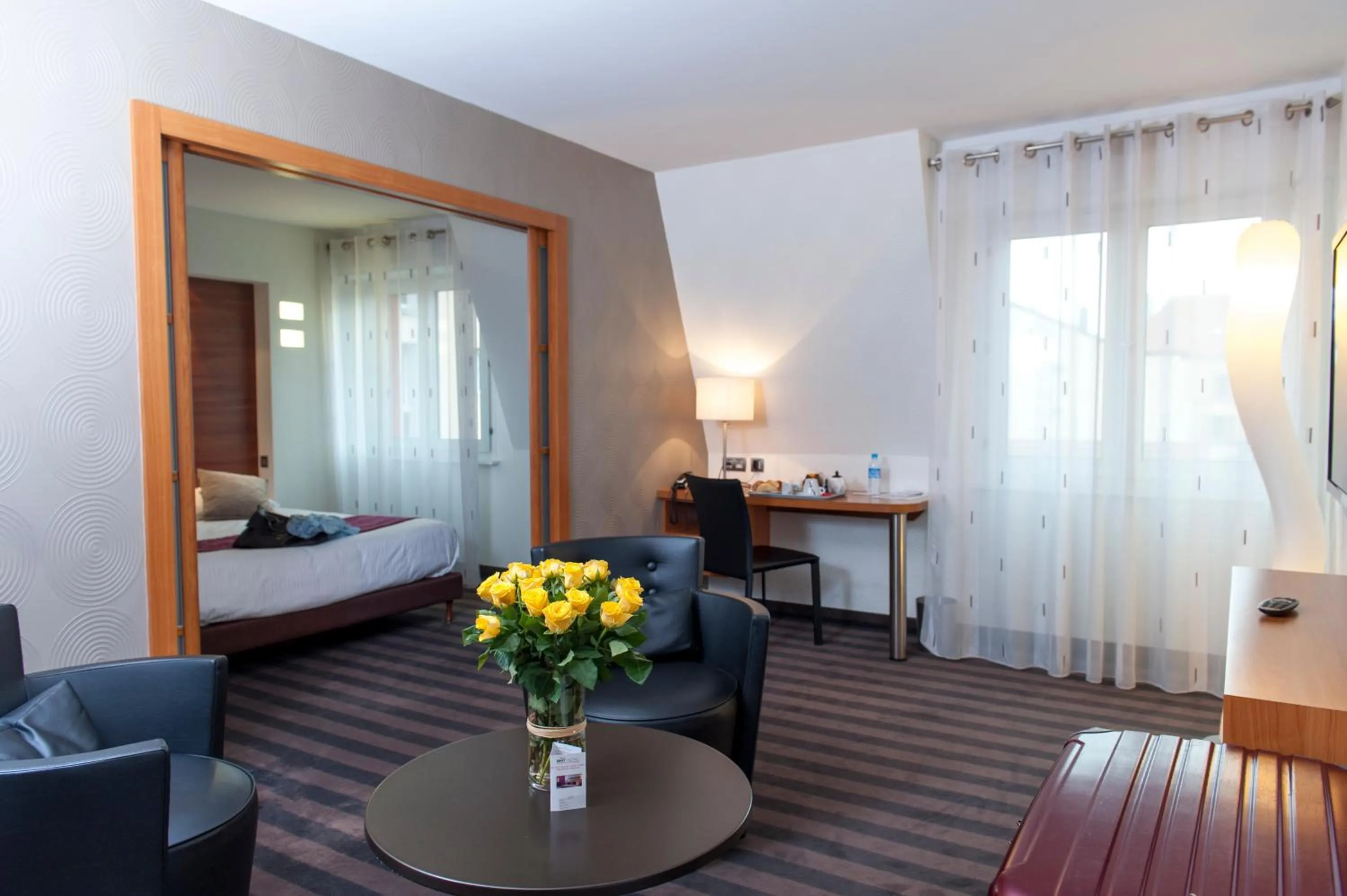 Living room, Bed in Brit Hotel Belfort Centre-Le Boreal