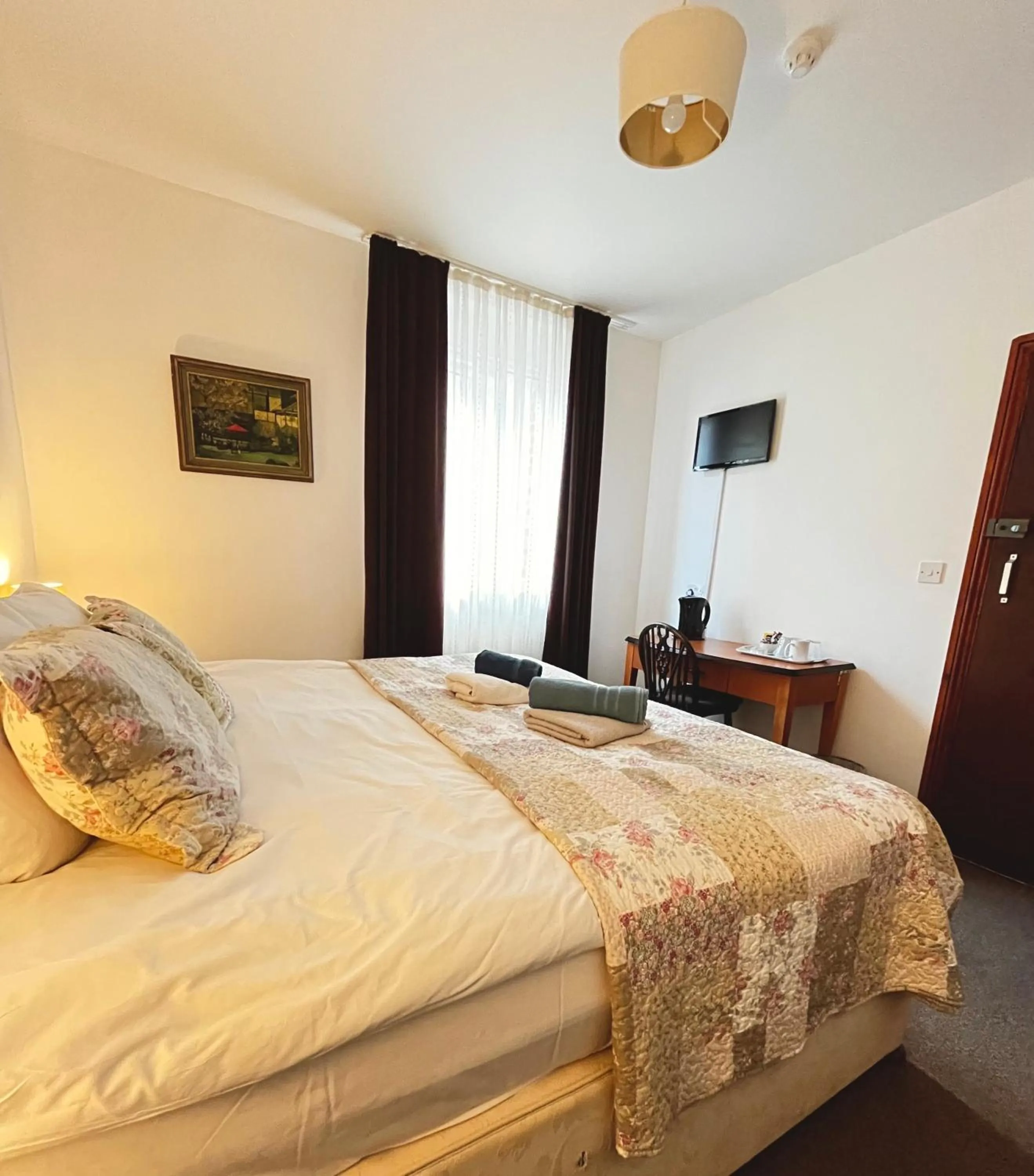 Bed in Old Palace Guest House