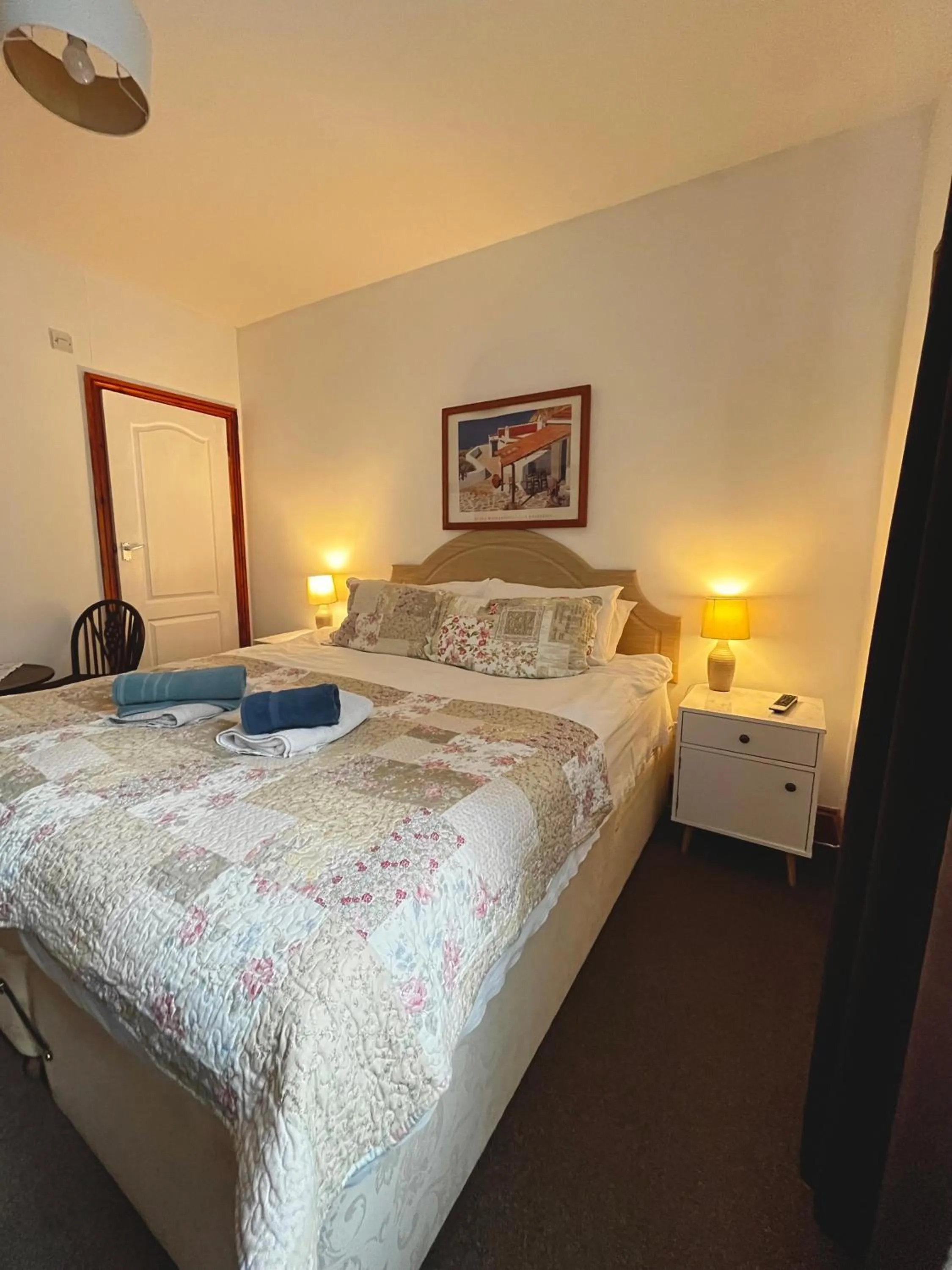 Bed in Old Palace Guest House