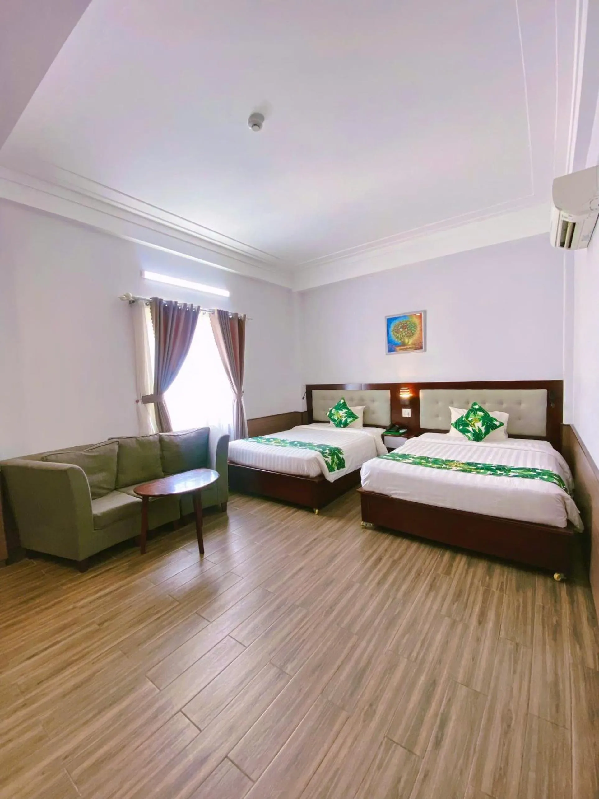 Bed in Flora Quy Nhon Hotel