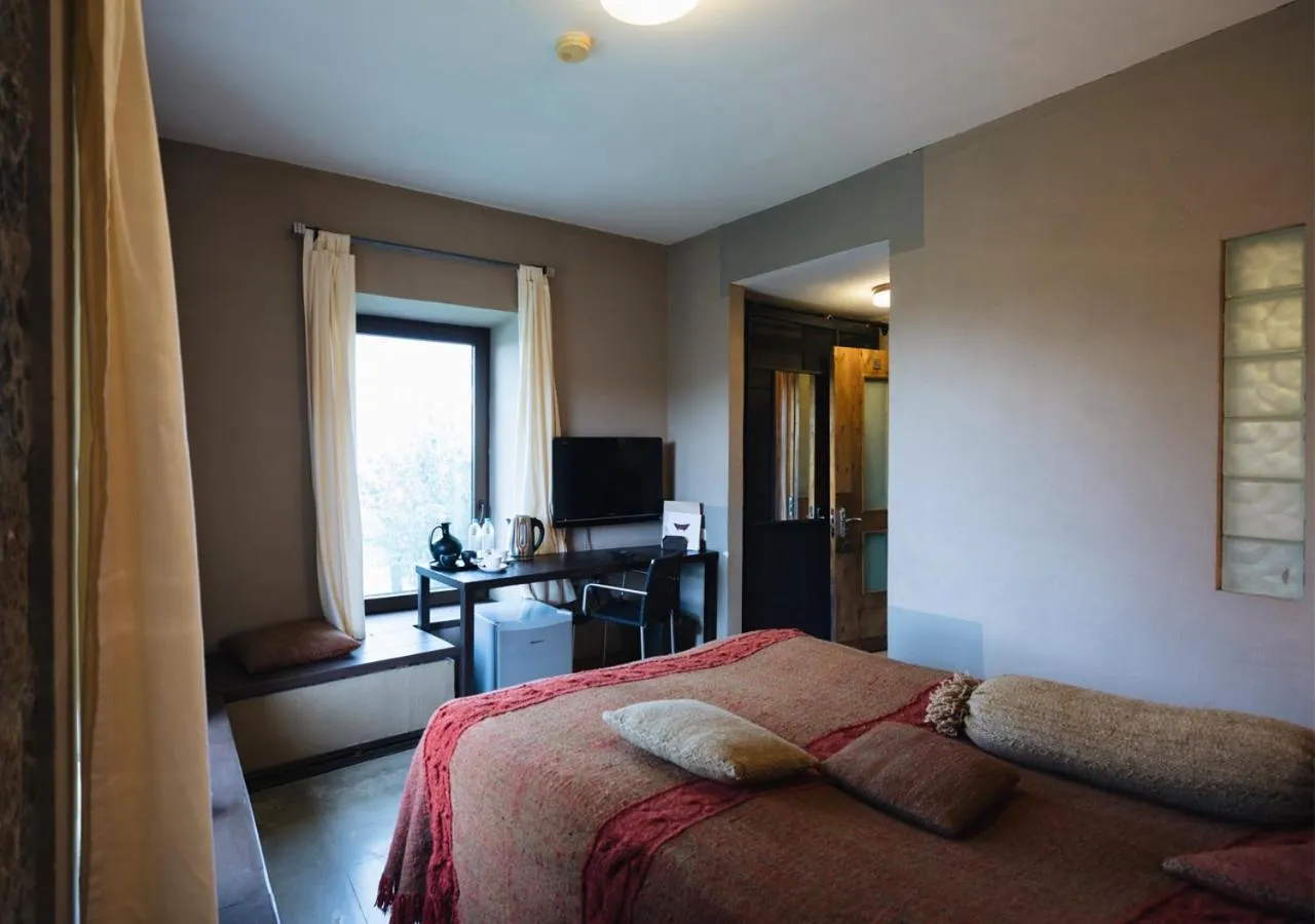 Bed in Tufenkian Avan Marak Tsapatagh Hotel