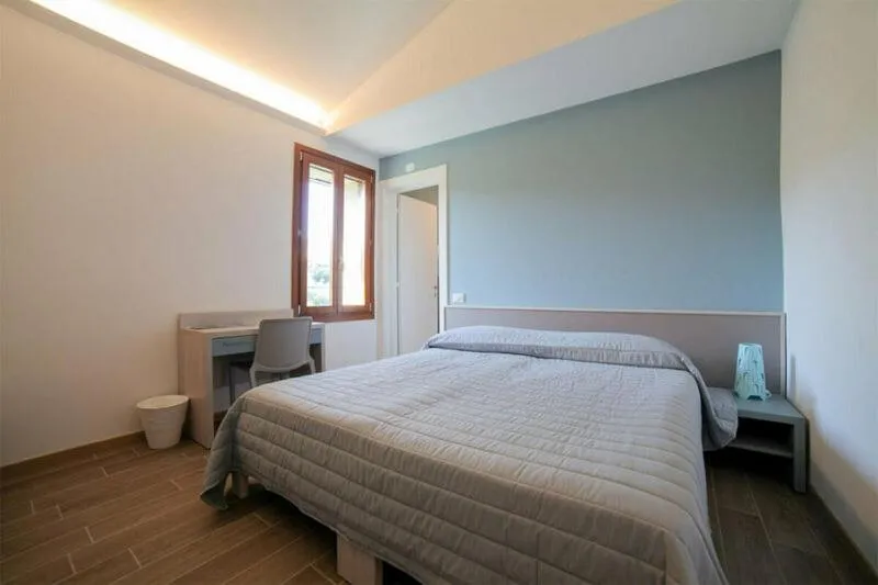 Photo of the whole room, Bed in Villaggio Della Salute Più