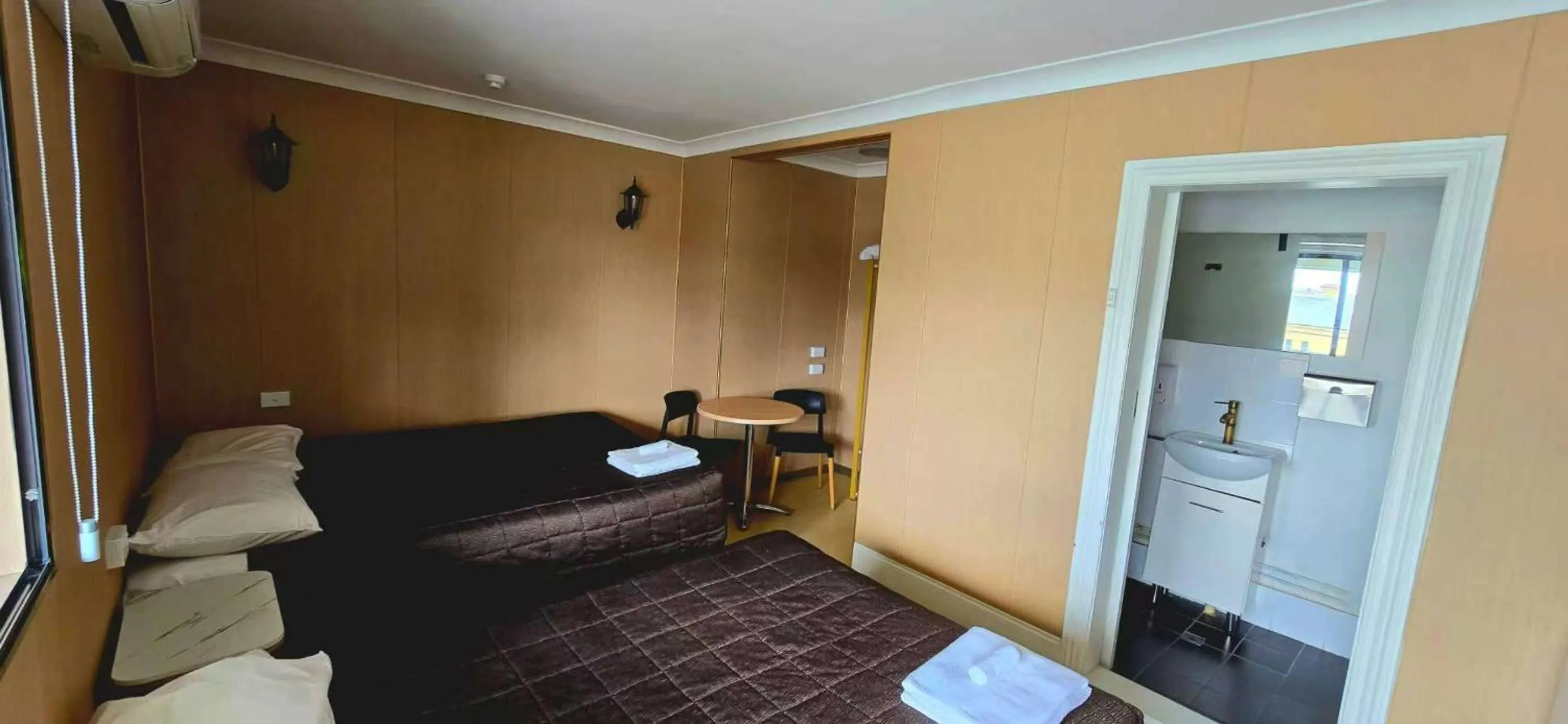 Bed in Alpine Heritage Motel