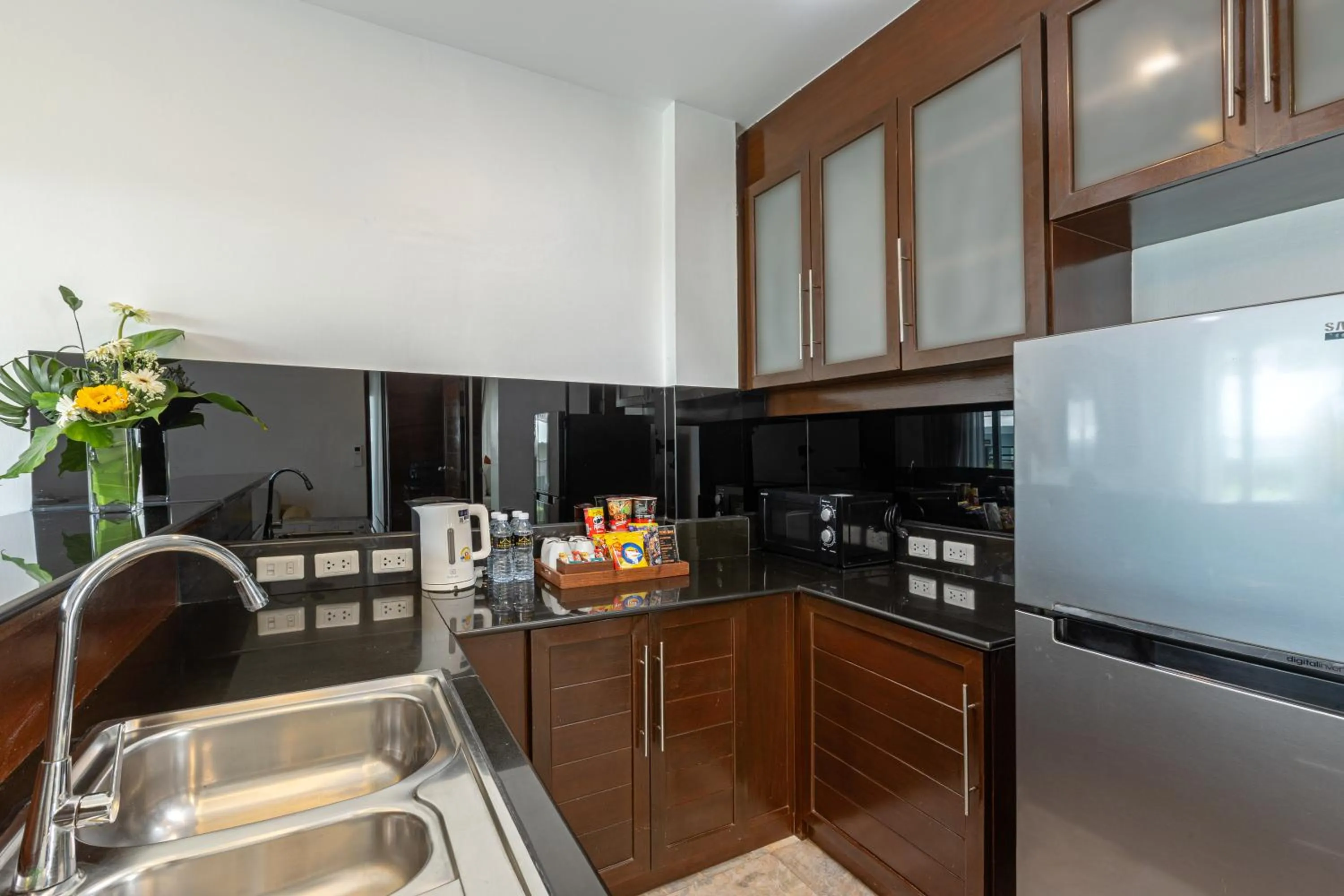 Kitchen or kitchenette in Phunawa Resort Phuket Karon Beach - SHA Plus