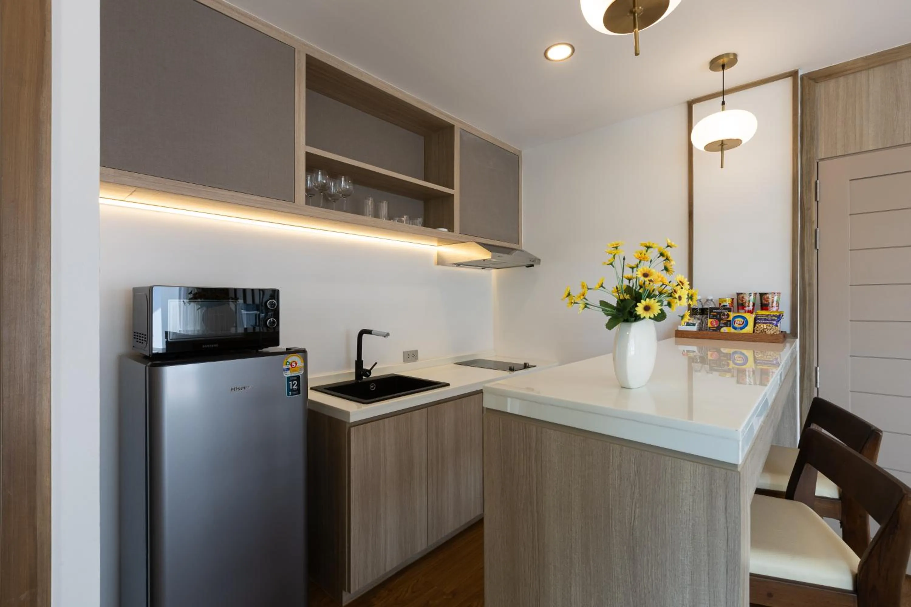 Kitchen or kitchenette in Phunawa Resort Phuket Karon Beach - SHA Plus