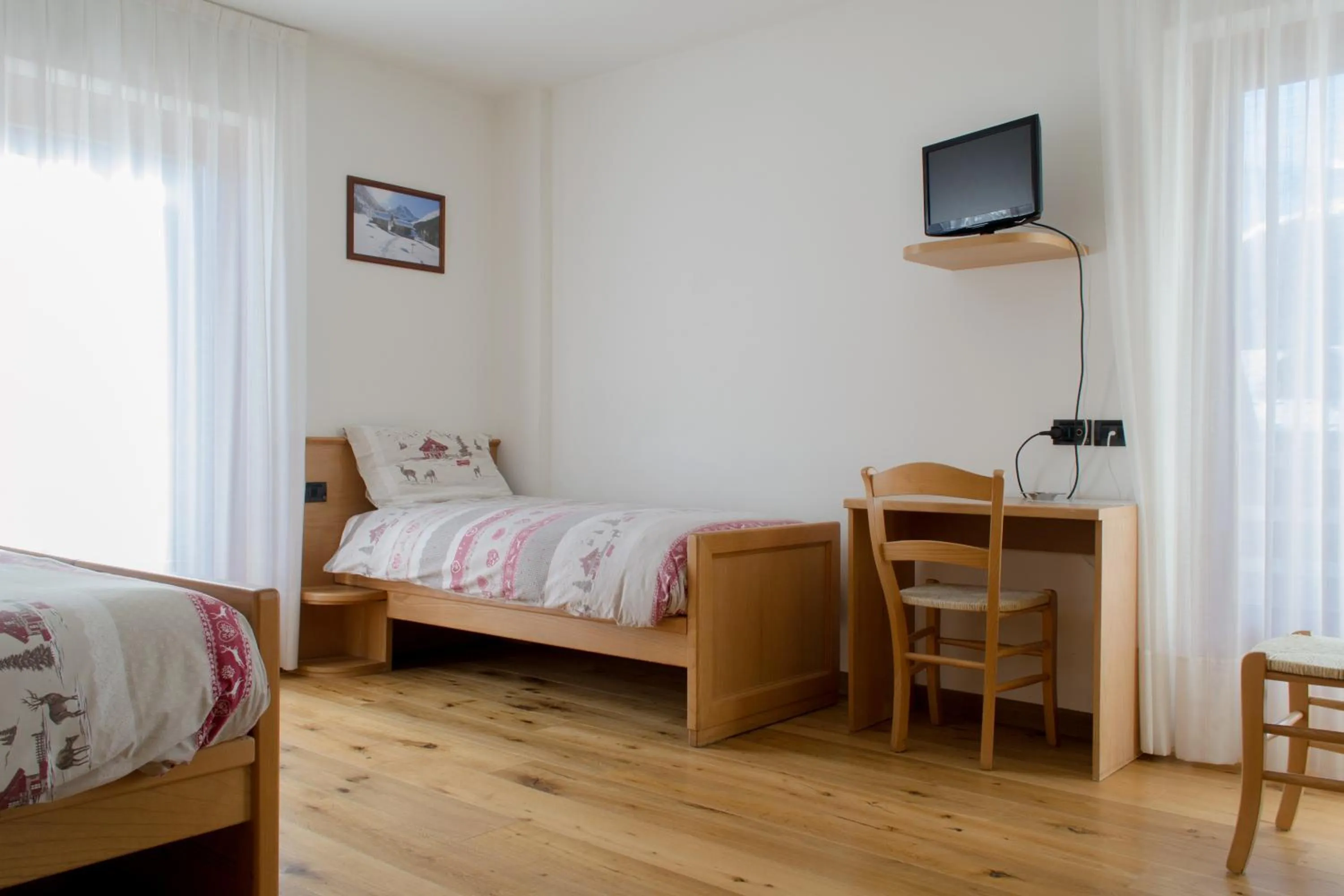 Bed in Meublè Rosalpina