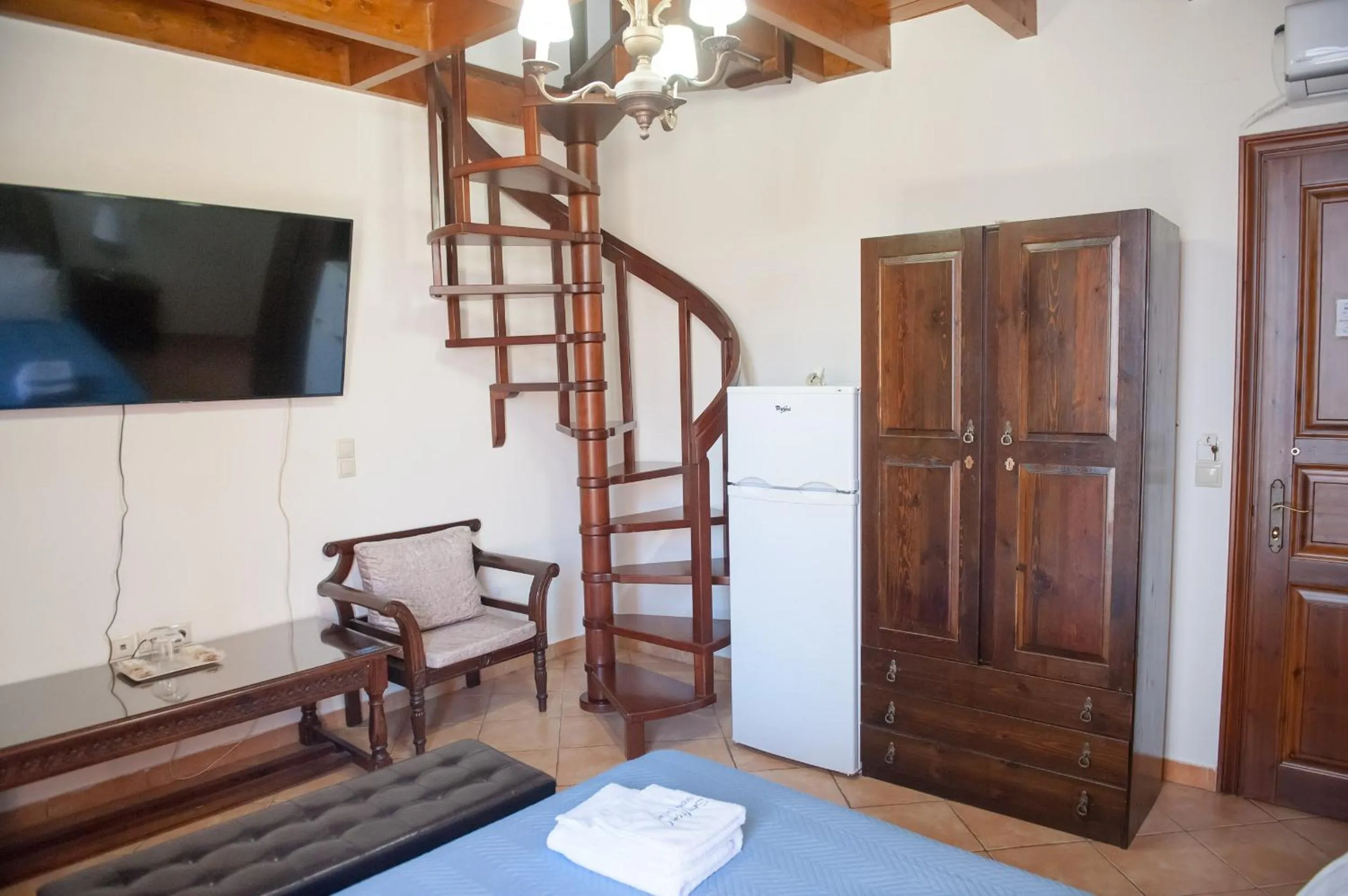 Photo of the whole room, Bed in SeaFront Stone Suites