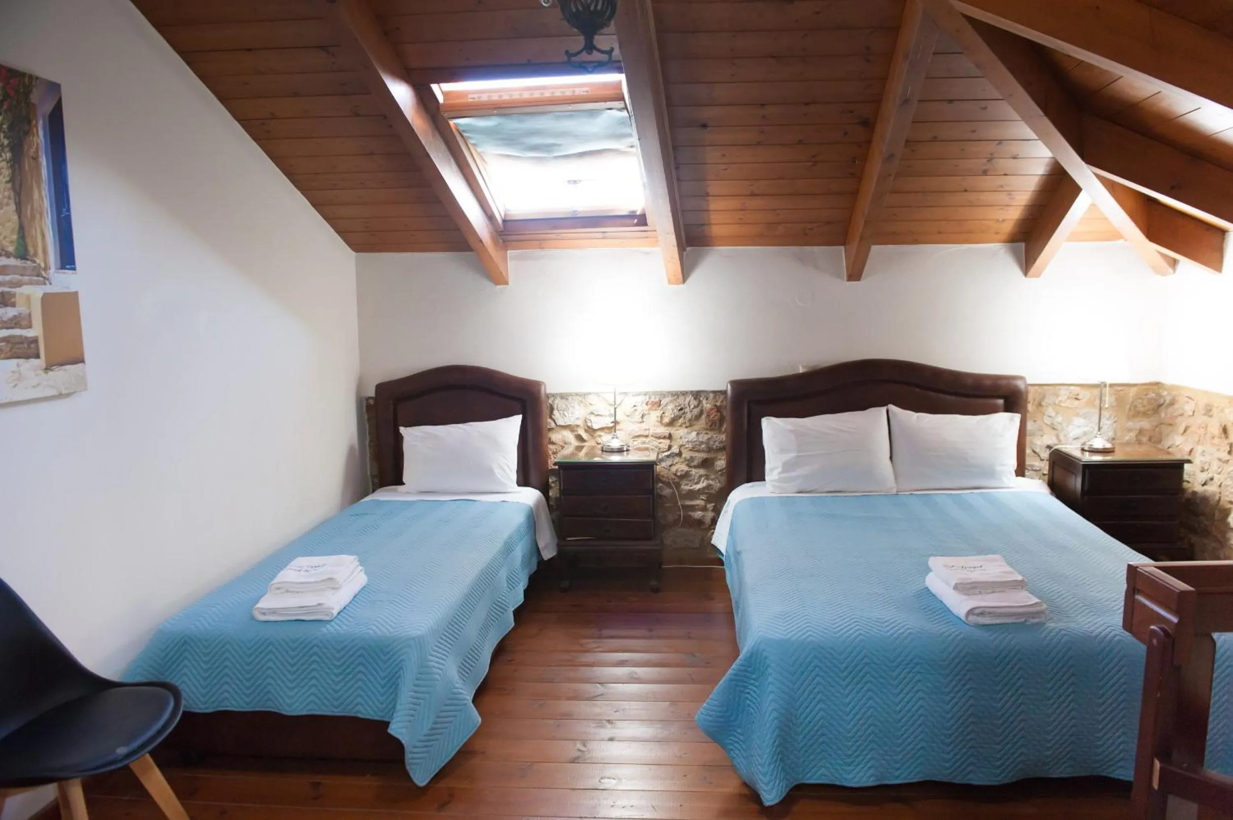 Photo of the whole room, Bed in SeaFront Stone Suites