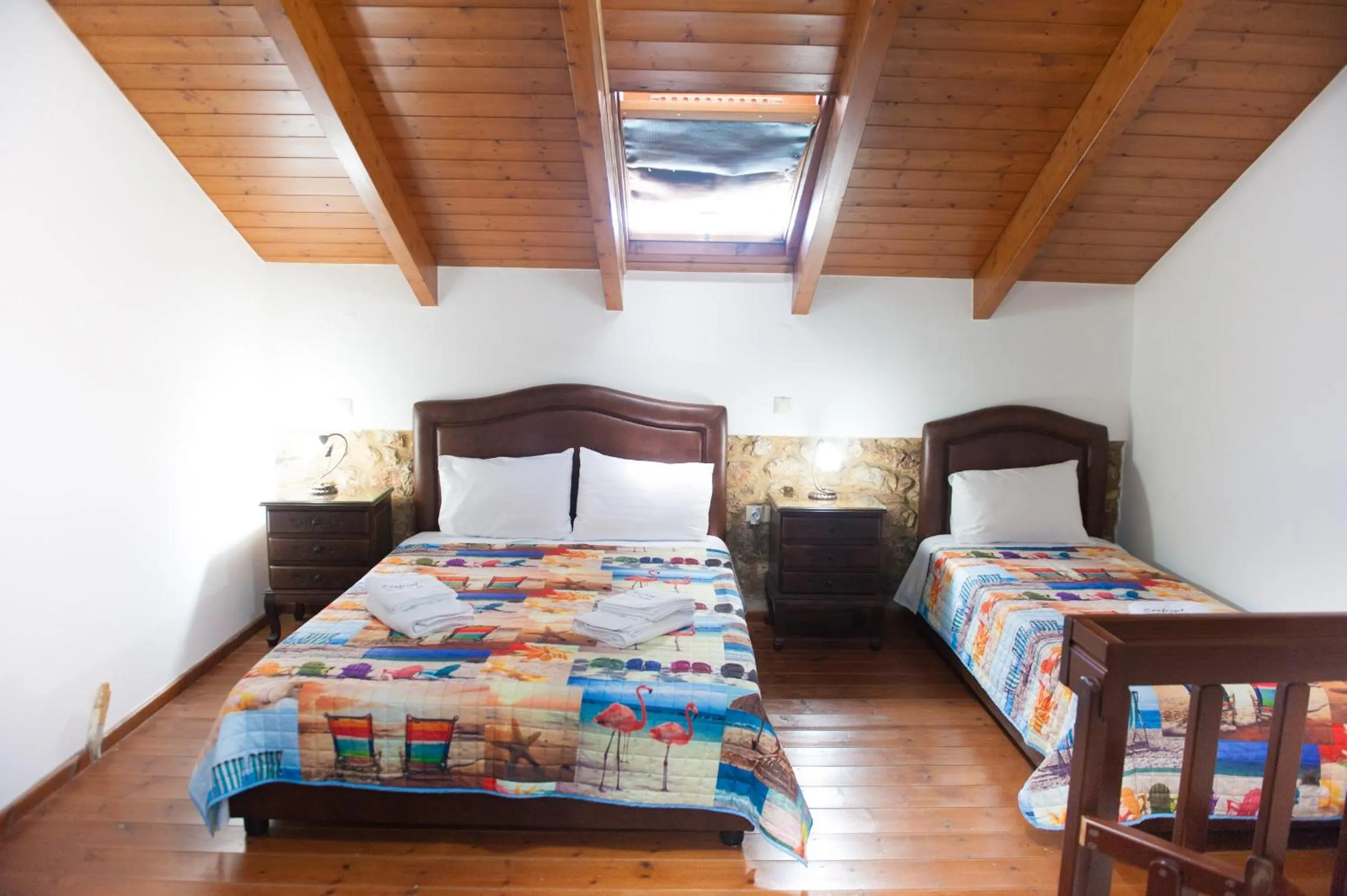 Photo of the whole room, Bed in SeaFront Stone Suites