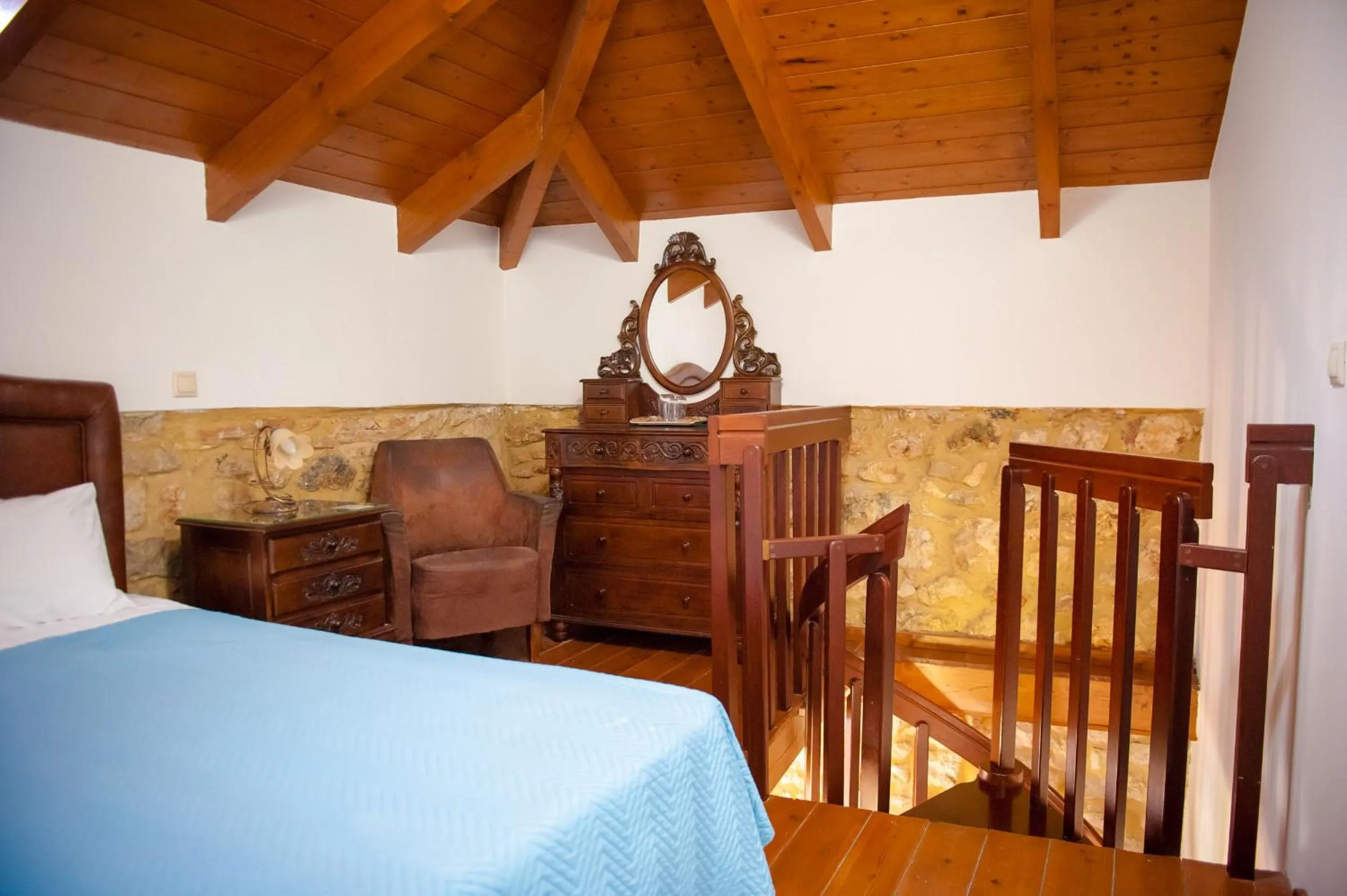 Photo of the whole room, Bed in SeaFront Stone Suites