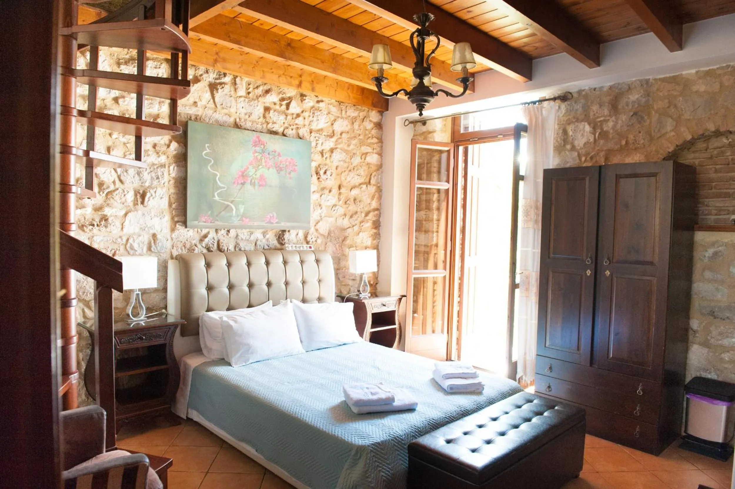 Photo of the whole room, Bed in SeaFront Stone Suites